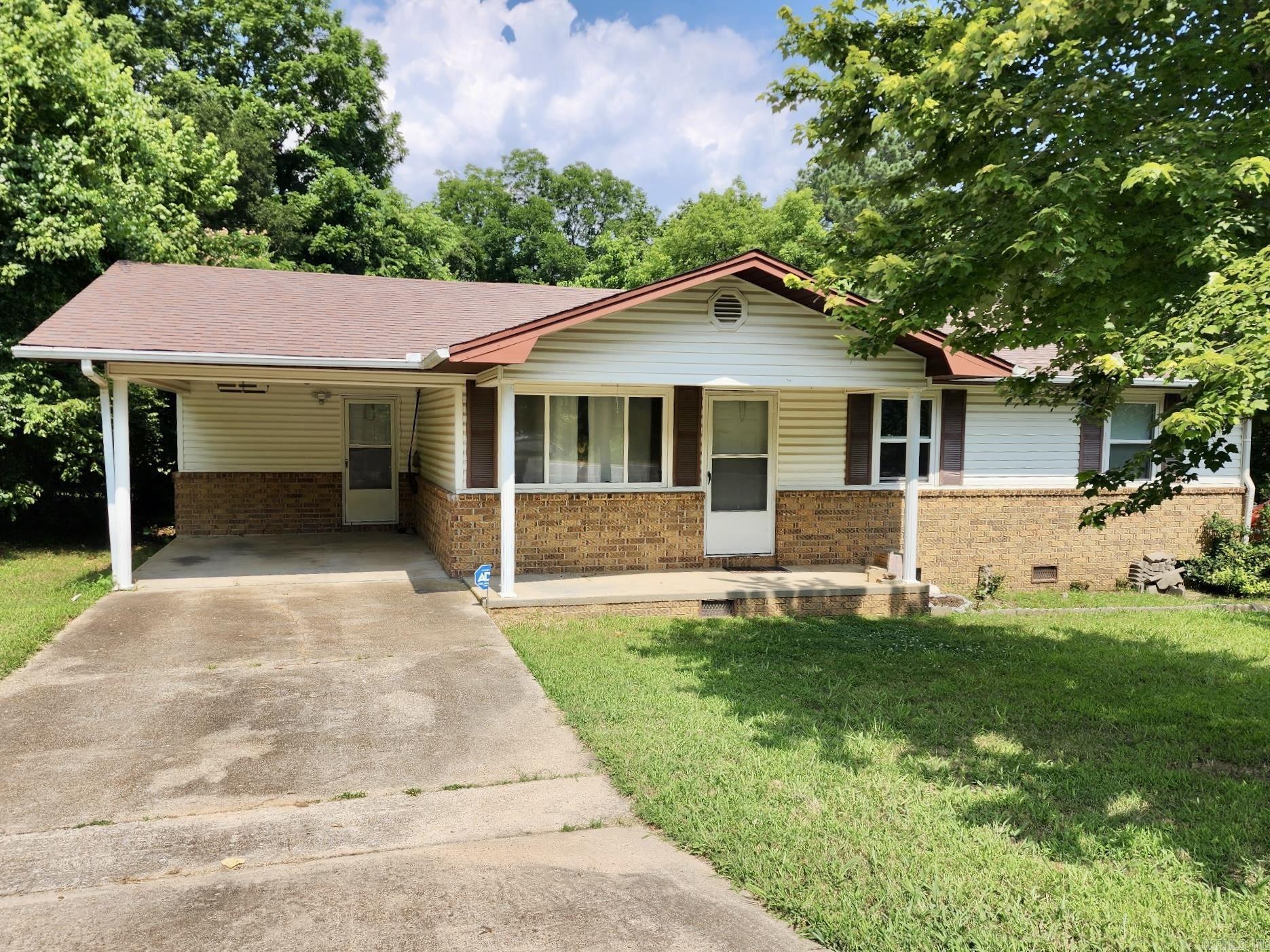 Welcome to this charming 4-bedroom, 2-bath home tucked away in the Ozark Mountain town of Mount Pleasant. Located just a short distance from the city park, this home has a spacious yard ideal for gardening, entertaining, or simply enjoying the surroundings. The property has two outbuildings, perfect for storage, a workshop, or hobby space. Inside, you'll find a warm and inviting layout with a sunroom providing flexible living areas.