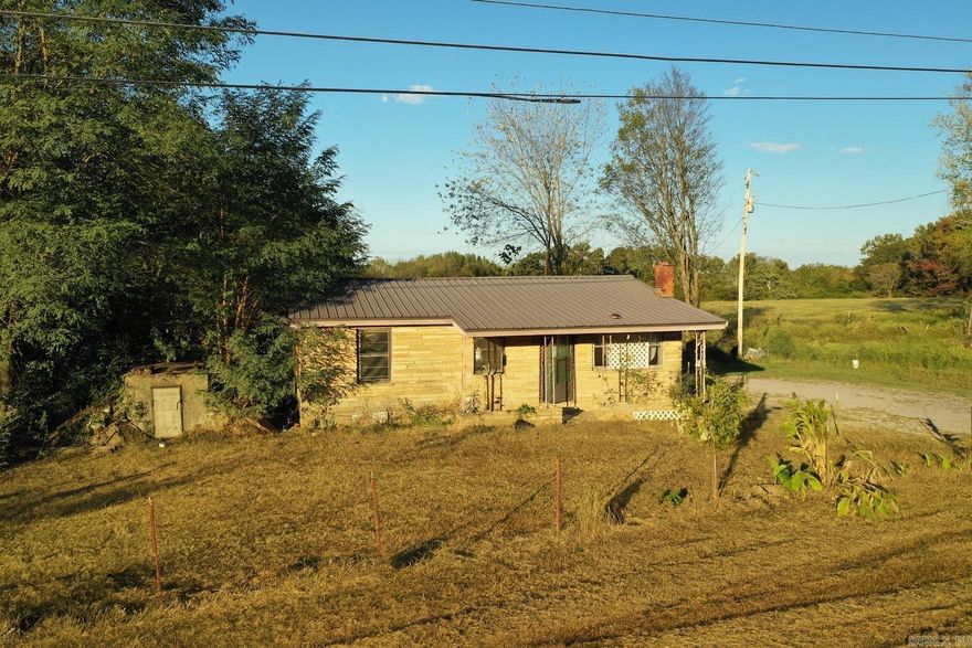 Nestled in the quiet hills of northeast White County, this 12.49± acre property offers privacy, open space, and endless potential. The home sits among mature trees with a private pond and is ready for remodeling—your blank canvas to design, expand, and make your own. A gravel drive leads from Hwy 167, with plenty of parking and space for additional buildings or a garden. A brand-new 30’x50’ shop (built summer 2025) features two roll-up doors and a 12’x20’ plumbed room perfect for a future bathroom or workspace—ideal for living on-site while you remodel or build your dream home. The land offers open pasture for livestock or gardening, shaded tree lines for privacy, and frontage on both Hwy 167 and Scoggins Rd. Enjoy fishing in the private pond or relaxing by the spring-fed Coon Creek. Power and water are at the road, and an on-site well provides excellent water. Perfect for horses, a hobby farm, or a quiet country retreat!