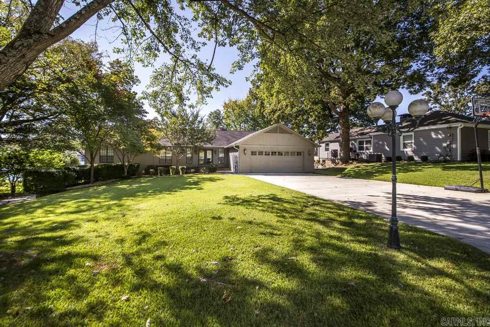 Completely updated lake front home with private boat dock, swim dock, boat ramp, and lift on gorgeous Lake Hamilton! This beauty features 7 bedrooms, 5.5 bathrooms, formal dining, multiple living areas, screened in porch, saltwater pool, hot tub, fire pit, water feature, & outdoor built-in grill w/ granite counter tops. Driveway will accommodate up to 10 vehicles. Kitchenette downstairs with separate entrance and private drive.