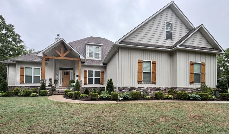 Welcome to this exceptional property in the highly sought after Springhill Community of Greenbrier. This dream home offers the perfect blend of comfort, functionality and style. The floor plan is incredibly desirable for multi-generational living featuring 5 bedrooms (three of which are en-suite), 4.5 baths, 3 car side entry garage on a semi-secluded street and wooded 2.23 acre lot. This quality well built custom home is a beauty with tons of upgrades! Upon entry you find a spacious open-concept living area anchored by a wood burning fireplace flanked by custom built in shelves and lower cabinets. A bright open kitchen flows into the comfortable family room offers an oversized island/coffee bar/walk in pantry and stainless steel appliances including double ovens/5 burner gas cooktop/microwave/dishwasher/3 door refrigerator. The adjacent dining room overlooks the large patio and backyard. The main level offer a spacious main bedroom with direct access to the patio/yard. This suite features tray ceiling, large windows, a sitting area with custom built-in's and a large bathroom with dual vanities, private water closet, his/her walk in closets. (continued in confidential remarks)
