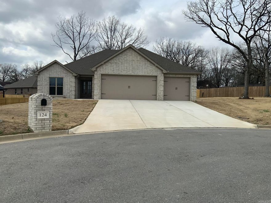 New Construction: Beautiful open floor plan features 4 bedrooms, 2.5 baths with luxury vinyl flooring throughout.  Kitchen features an abundance of white painted cabinets and stainless- steel appliances, large island with a nice large walk-in-pantry. Nice large laundry room with a sink and extra cabinets and room for a second refrigerator.  Split bedroom plan.  Spacious master suite with a separate walk-in shower, double sinks and a very nice (extra- large) closet with built-ins.  Concrete covered deck with a ceiling fan.  Three car garage with storage and a walk up stairway to attic. Tankless hot water heater. SF approx. measuring encouraged.