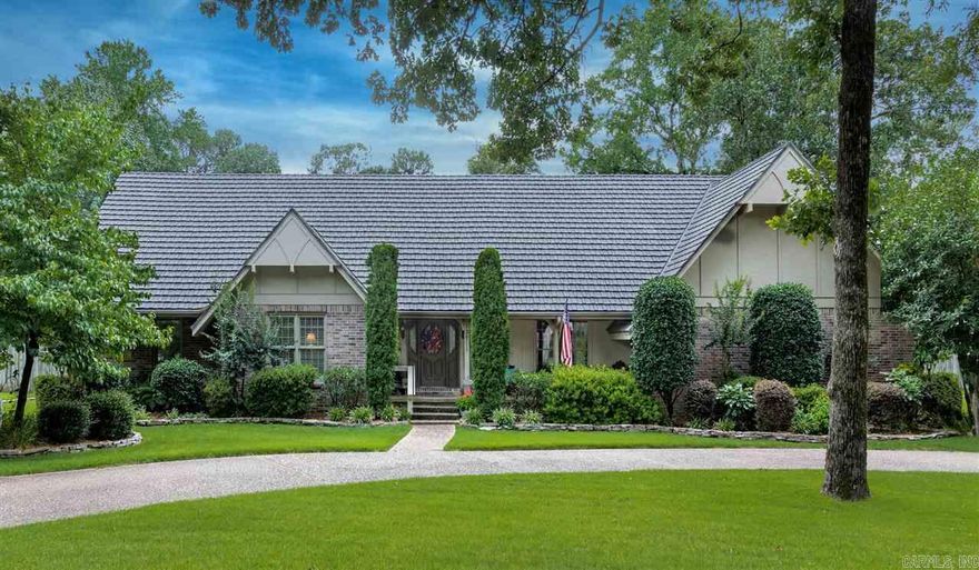 Beautiful family ready home, mudroom, laundry, unbelievable storage throughout, guest 1/2 bath, eat-in kitchen, formal dining custom chandelier, real wood floors, solid wood doors, crown molding, built-ins, plantation shutters and blinds, fans, massive cathedral ceiling in den, sep. office, wet bar, master suite down, 3 oversized BRs & 2 full baths up, 3 decks, alarm & ring cameras, $50,000 new sod & updated sprinkler system, Generic home generator, Shake look metal roof with lifetime warranty... must see!