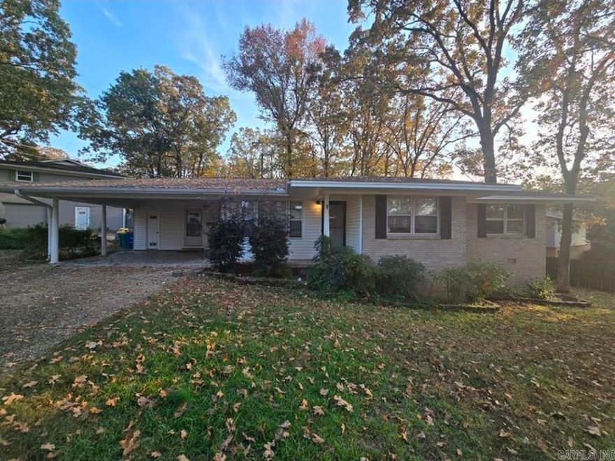 This inviting single-story home offers 3 bedrooms and 2 bathrooms, designed with comfort, convenience, and easy living in mind. A side driveway with a carport provides sheltered parking, along with an outdoor storage closet for added space. Inside, youll find hard-surface flooring and a neutral color palette throughout, creating a clean and low-maintenance environment. The galley kitchen with a mini peninsula provides generous countertop space and ample cabinet storage ideal for everyday cooking and meal prep. Nearby, a dedicated washer and dryer closet includes open shelving for extra organization. Two bedrooms share the hallway bathroom, which features a bathtub and showerhead combination perfect for guests or family use. The primary bedroom offers added privacy with its own ensuite bathroom, complete with a walk-in shower. Enjoy outdoor living in the fenced backyard, which includes a railed patio area great for relaxing, dining, or entertaining. This home blends practicality and comfort, offering a functional layout and welcoming spaces inside and out.