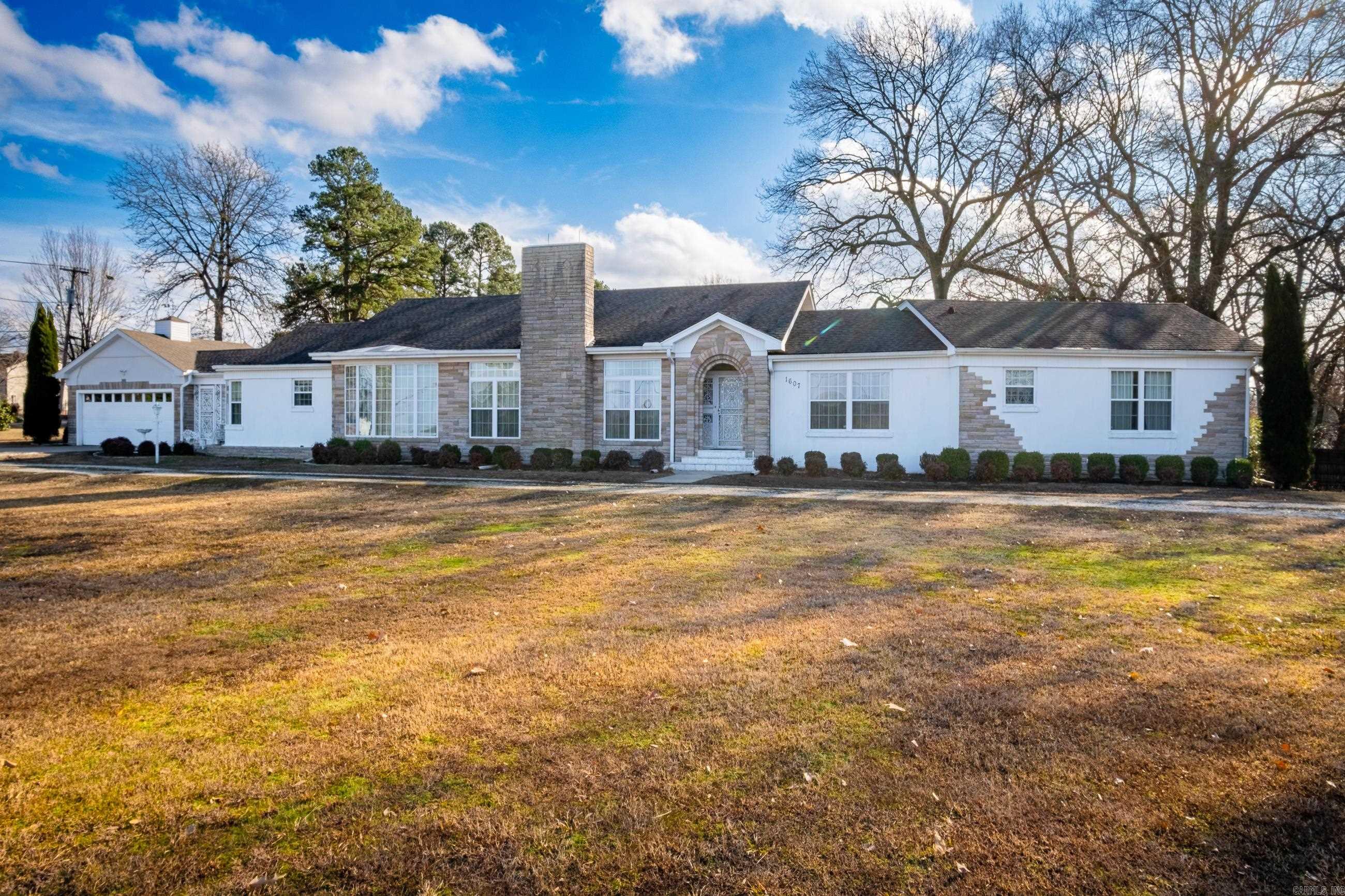 Don't miss this incredible opportunity to own a home that is local to everything, but still offers you plenty of space to stretch out! Located in the city of Malvern and only 20 minutes to Hot Springs, race tracks, shopping and dining galore! This home was the talk of the town when originally built and the current owners have taken great care of this home over the years! This property is nestled on 1.37 acres with a shop and a fenced in backyard. The layout of this home provides plenty of space to host guests, in addition to a full-size sunroom that stays cozy in any weather! The formal living room and the sitting room can be connected for more space or separated for privacy with a sliding partition! The home is heated by and cooled with central HVAC, but has additional gas heaters just in case you get any bad winter weather! There's also a reinforced safe room that could be used as a tornado shelter or storage room! Home speakers fill the house for your entertainment in addition to other amenities! The kitchen offers plenty of space and connects to a formal dining room for serving guests! The shop is a great addition with a connected lean-to for any storage needs!
