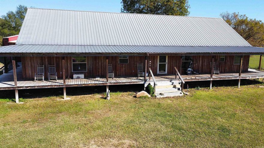 Property Overview Beautiful 2,380 sq. ft. custom home built in 2009, featuring wraparound porches and situated on 87.6 acres of scenic land. This property offers a perfect blend of comfort, security, and country living with modern amenities throughout. • 3 spacious bedrooms and 2.5 bathrooms • Large primary suite with a luxurious bathroom featuring a double-head walk-in shower • Open, inviting kitchen with center island and ample storage • Utility/laundry room and abundant closet space • Woodwork and custom tile finishes throughout • Secure 8’x5’ concrete safe room with a Fort Knox reinforced door • Energy-efficient spray foam insulation (3” insulation – 6” concrete – 3” insulation) • New HVAC system installed in 2022 • Large crawl space with heavy moisture barrier • All appliances convey • 87.6 acres: approximately 40+ acres of pasture, 20 acres of timber, and 25 acres of clearcut  • Nearly half a mile of Saline Creek frontage • 0.33 miles of highway frontage on the south end plus paved county road access • Two ponds and one barn • 40’x50’ fully insulated shop with bathroom and large lean-to  • 40’x30’ covered carport connecting the house and shop • Whole-home/shop generator