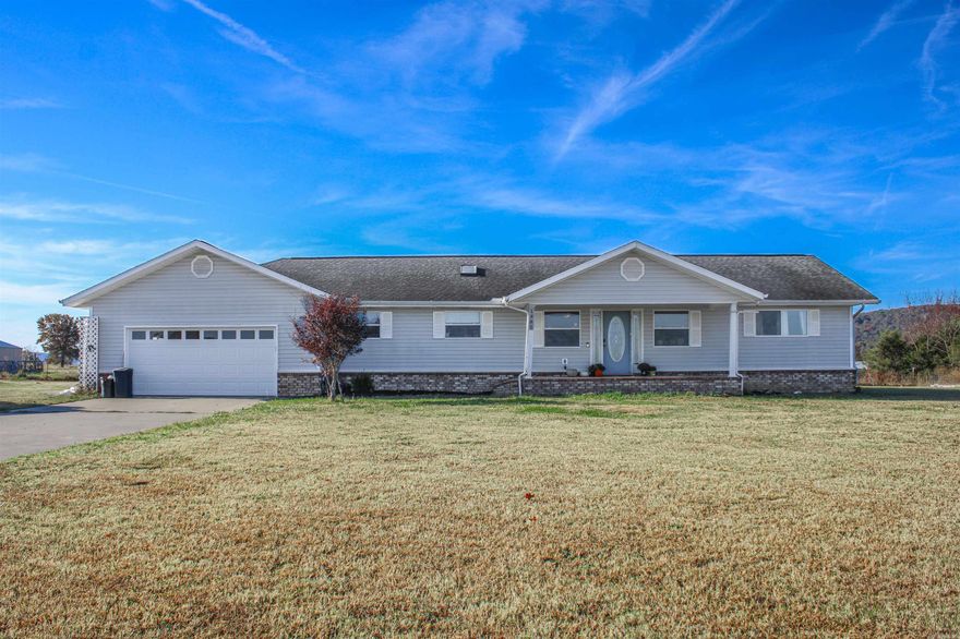This rural property features a 3,580 sq ft home on approximately 2.5 acres (subject to new survey). With 4 bedrooms, an office, a large bonus room that could easily serve as a 5th bedroom, and a whole other living area downstairs, this home offers tons of space! Enjoy peace of mind with an extra water pump for added pressure and a natural gas generator. Out back, a spacious concrete patio includes a partially finished outdoor kitchen—perfect for entertaining. The property also includes a chicken coop and raised garden beds. Plus a large shop!