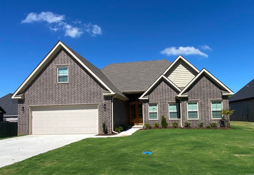 This beautiful home is located in the Brookland School District and is serviced by City Water and Light.  The gorgeous floor plan is 5 bedroom, 2.5 bath and has a bonus room on the second level, the house boasts 12ft raised ceilings in the great room, kitchen, and breakfast area. The exterior is covered with all brick and multiple windows surrounding the breakfast area allowing for plenty of natural light. Tray ceilings are found in the master bedroom, the master bath features double sinks, free standing soaker tub, a custom tile shower with a glass shower door. Hardwood flooring is found in the great room and hallway, tile in the laundry room, kitchen, and bathrooms. Carpeting can be found in all bedrooms and the bonus room. Additional features include crown molding, ceiling fans, prefinished wood shelving units, granite countertops in the kitchen and bathroom, tile backsplash lighting in the kitchen, an electric fireplace, a tankless hot water heater and foam insulation.