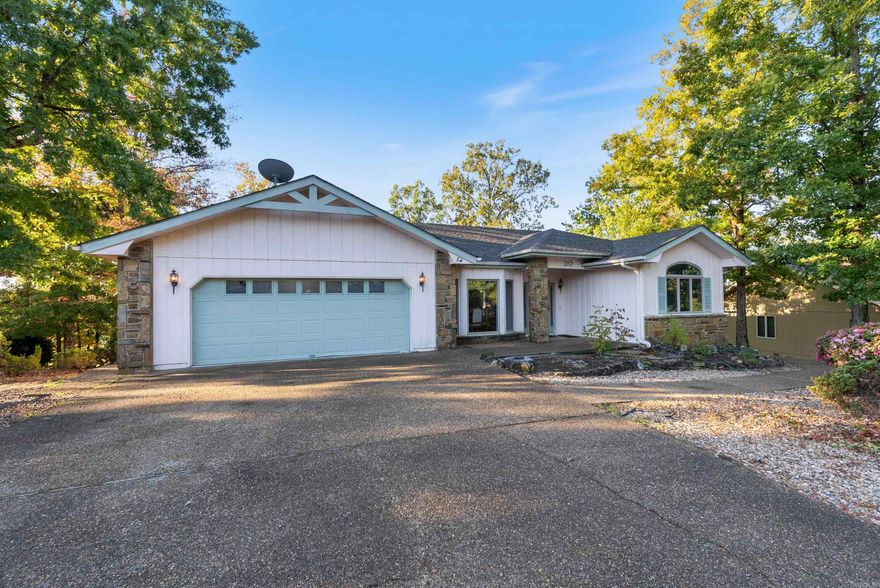 Located on a cul-de-sac at the first tee of the Magellan Golf Course and just a short walk to the clubhouse.  This home has large windows with a nice view of the golf course and nature, or enjoy the view outdoors on the newly floored deck.  The garage is equipped with abundant cabinetry for your storage needs, while the spacious, air-conditioned basementācomplete with a half bathāis a hobbyist or craftsmanās dream space. Just minutes from stunning Lake Balboa, where you can enjoy boating, fishing, and scenic walking trails, this home combines golf-course living with the best of Hot Springs Village recreation.