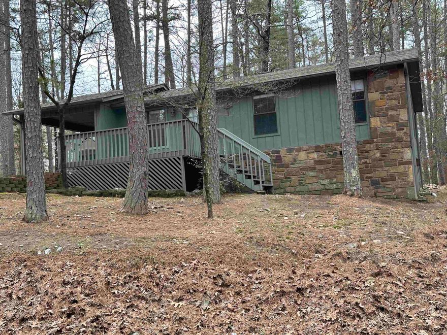 Check out this cozy one level 3-bedroom 2-bath home nestled in the woods on a secluded corner lot located near the west gate in Hot Springs Village. Home has new quartz countertops in kitchen, new refrigerator, electric cookstove and dishwasher are approximately 3 years old. Water heater is approximately 1 year old. Roof, gutters, and condenser unit are approximately 3 years old. Hot Springs Village is a large private gated community with 26 thousand acres, 9 golf courses, 11 lakes, approximately 50 miles of walking/hiking trails and much more!  AGENTS SEE REMARKS