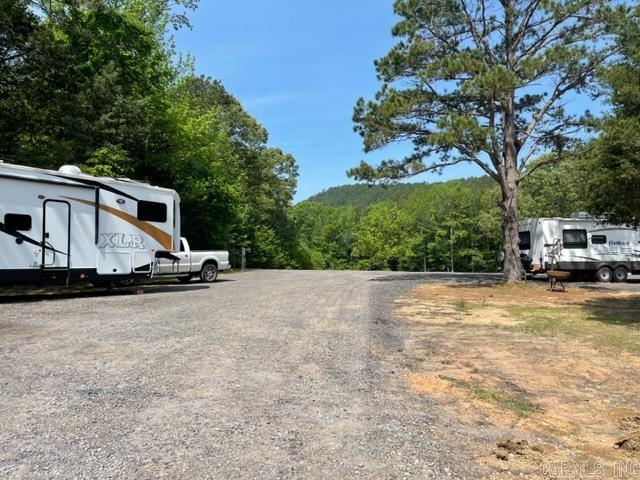 Once in a lifetime commercial opportunity in the heart of trail country! Located just outside of Big Fork, this 5.37 acres boasts 5 RV sites with electric, with room for more! Also has two septic systems. What about cabins? The land would be PERFECT for them, and there is plenty of room to build all sorts of structures. Brand new well pump and well house. Nice black gravel rock driveway leads up to a large plateau of parking, overlooking the property and mountain views. Private gate and cedar post fencing. Several other outbuildings also on the property could be revamped for a variety of uses. Property borders Polk 61 and Highway 8E, just north of the Big Fork Mall. National Forest is almost at your back door - just a short drive down Polk 61. This is one of those properties that has worlds of potential and so many commercial possibilities for further development. This location is prime!