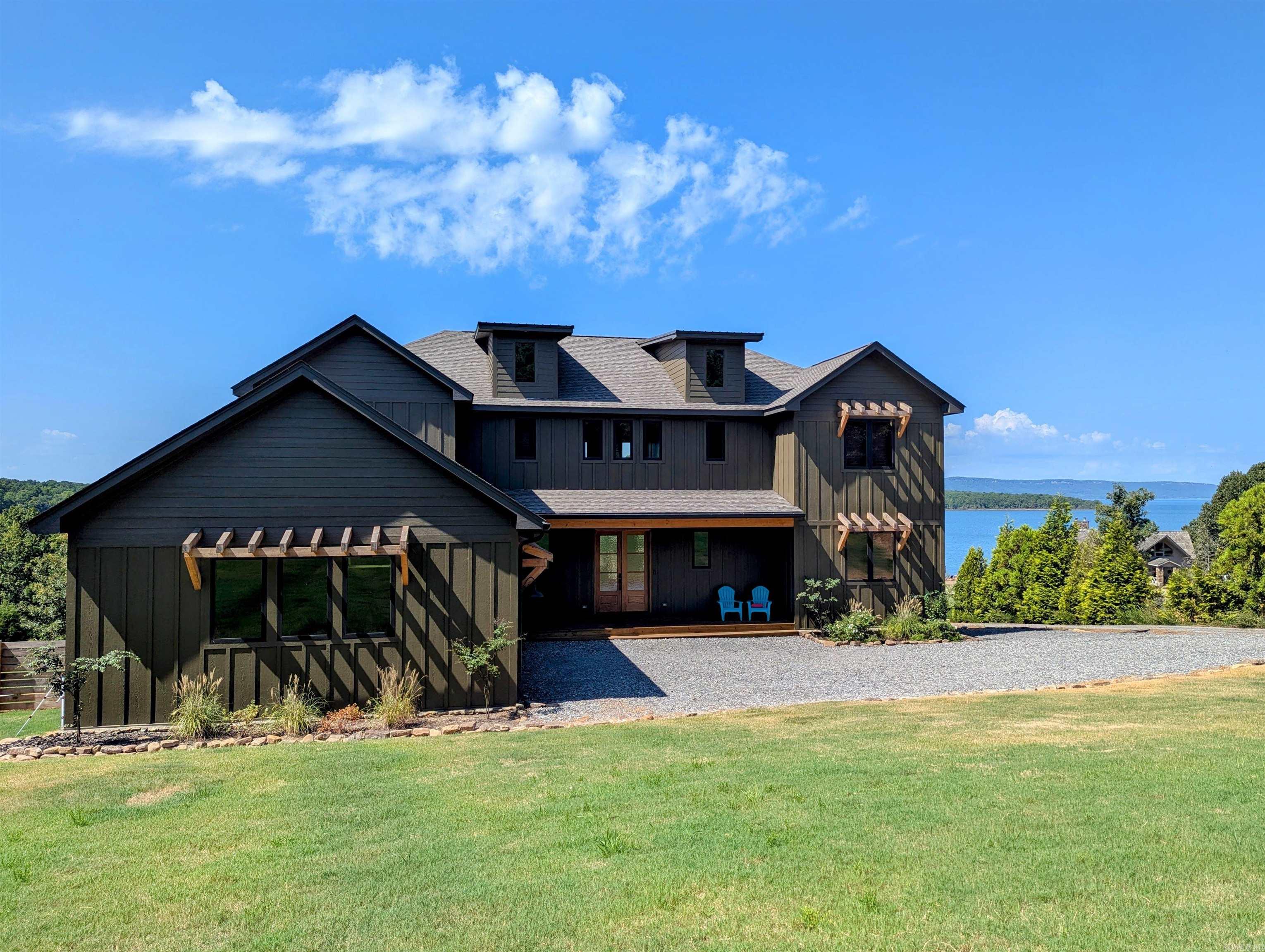 Stunning Fully Furnished Home on Greers Ferry Lake with Boat Slip! This newly built 4 bedroom, 3.5 bath home checks all the boxes. Features include Anderson windows and doors, large two car garage, two large primary suites, walk-in pantry, high end appliances with standalone ice maker and wine cooler, exceptional covered outdoor living spaces on two levels, best in class views and a beautiful shoreline. One of the best we've ever seen!