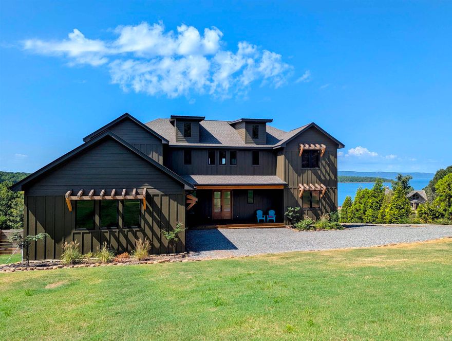 Stunning Fully Furnished Home on Greers Ferry Lake with Boat Slip! This newly built 4 bedroom, 3.5 bath home checks all the boxes. Features include Anderson windows and doors, large two car garage, two large primary suites, walk-in pantry, high end appliances with standalone ice maker and wine cooler, exceptional covered outdoor living spaces on two levels, best in class views and a beautiful shoreline. One of the best we've ever seen!