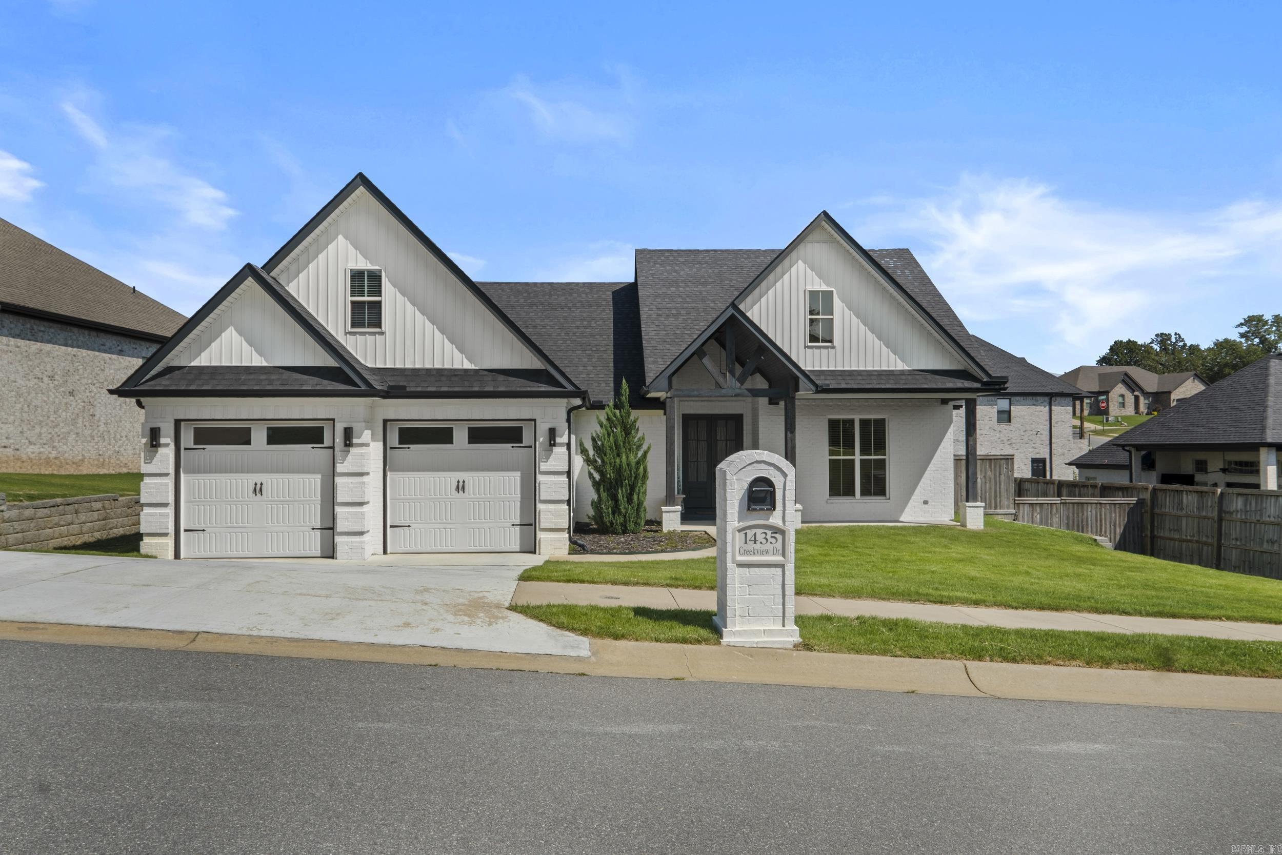 Beautifully maintained 1 ½-story home located in the highly sought-after Creekside Subdivision. This spacious 4-bedroom, 3-bath residence offers a split-level, open-concept floor plan with an office and a versatile bonus room upstairs. The inviting living room boasts 10-foot ceilings, expansive windows that fill the space with natural light, and a modern LED fireplace. The kitchen is a true centerpiece, featuring ample cabinet space, granite countertops, a large island with a farmhouse sink, and a walk-in pantry. The primary suite is a private retreat with a tray ceiling, a luxurious en-suite bathroom, double sinks, a standalone soaking tub, walk-in shower, and a generous walk-in closet. Additional highlights include a spacious laundry room with cabinets, counter space, a sink, and a hanging rail. The upstairs bonus room offers a full bath, closet, and additional storage, making it ideal for guests or a media/game room. Step outside to enjoy the covered patio, perfect for grilling and relaxing, overlooking a fully fenced backyard. Don't miss the opportunity to call this exceptional home yoursāschedule a showing today!