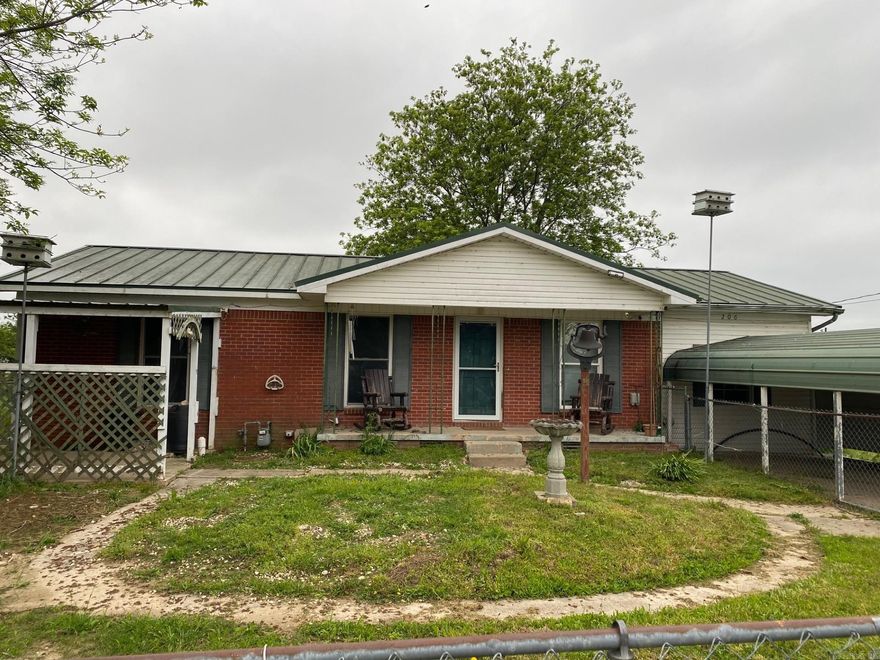 This 3-bedroom, 2-bath brick home offers 1,250 sq. ft. of comfortable living space with some updates. Enjoy the durability of a metal roof and the convenience of gas heat paired with window air conditioning for year-round comfort. The home features a new gas stove and refrigerator, adding modern touches to the kitchen. Outside, a chain-link fence provides security and functionality, perfect for pets or outdoor enjoyment. A great blend of character and updates, this home is ready for its next owner! Call today for your tour.