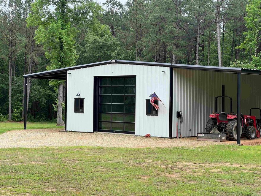 15.98 Acres in Genoa, prepped and ready for New home construction. Beautiful land with 1800 shop converted into residence. Master Suite down stairs with beautiful bathroom, boasting a large soaking tub, separate walk in shower,  & double sinks.   Large walk in closet, with washer and dryer connections. Home is wired with a 50 AMP hook up for generator, that can double as camper connection. 2 Inch water line runs from meter to house plus water line is prepped and located for future new home construction. Pad mount electric transformer is established and ready for future new home construction. House has 330 gallon propane tank that is used for the on- demand water heater. home is spray foam insulated,  & has 2 mini splits.The 10x16 out building is negotiable.