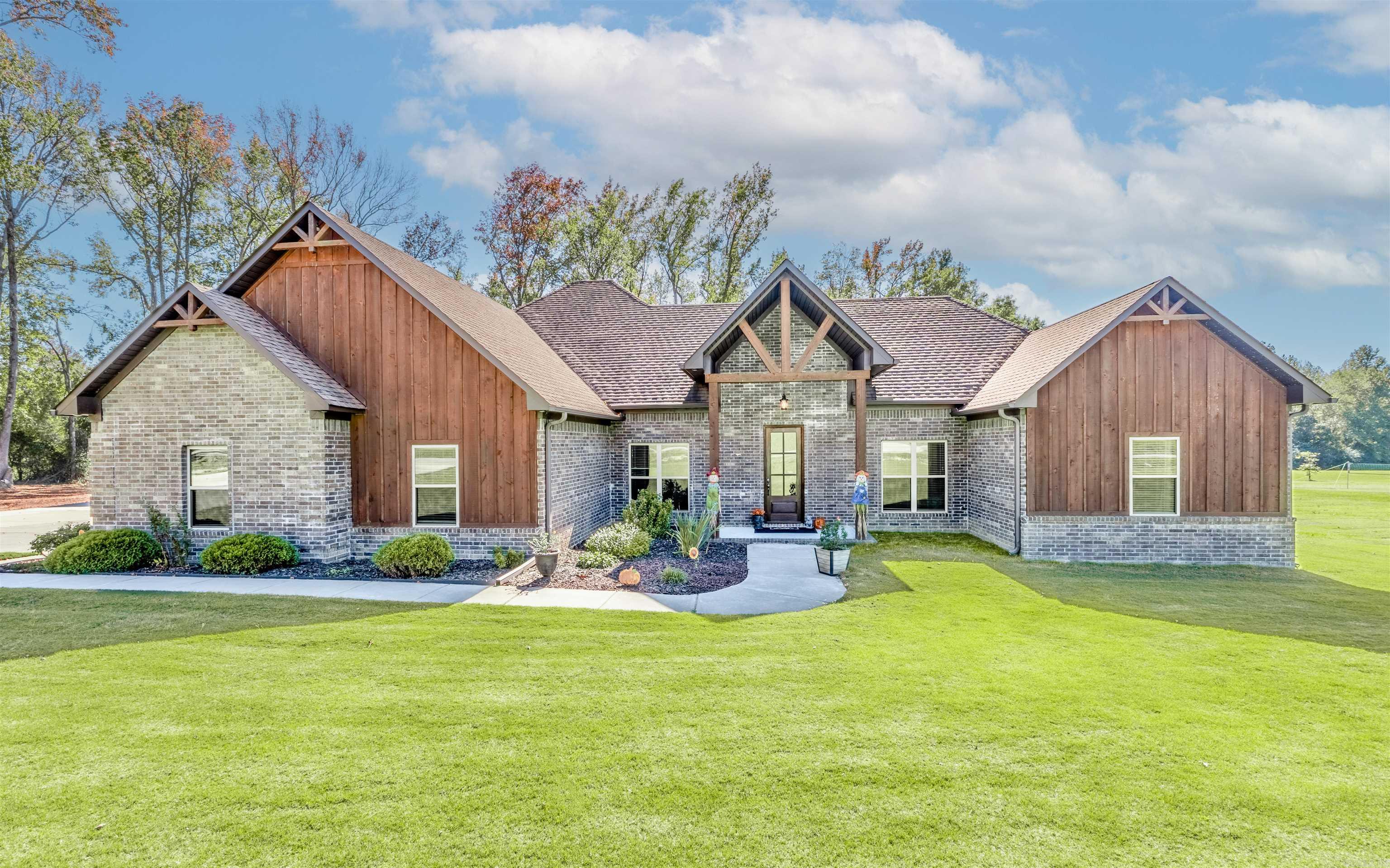 Check out this absolutely stunning 5 bedroom 2.5 bath custom home on over 2 acres in highly sought after Greystone Subdivision! As you walk in you're greeted with an open concept and a custom kitchen flowing into the living area, with a wood burning fireplace as center of attention! This well designed floor plan works great for any large family, featuring several custom finishes, board and batten wood siding and 10 foot ceilings throughout. Oversized 2 car garage and a fenced in back yard for your pets is always a plus. Looking for in-law quarters? There is also a 40x40 red iron shop that has an 800 sq foot apartment with no expenses spared, and built for high efficiency low cost utilities. Upstairs features A separate office that's heated and cooled as a bonus! This building also has a high bay garage door that will keep that RV or boat secure and a solid concrete safe room added for your peace of mind as well. If you are looking for that special place with plenty of yard to enjoy, book your showing today and make this Home!