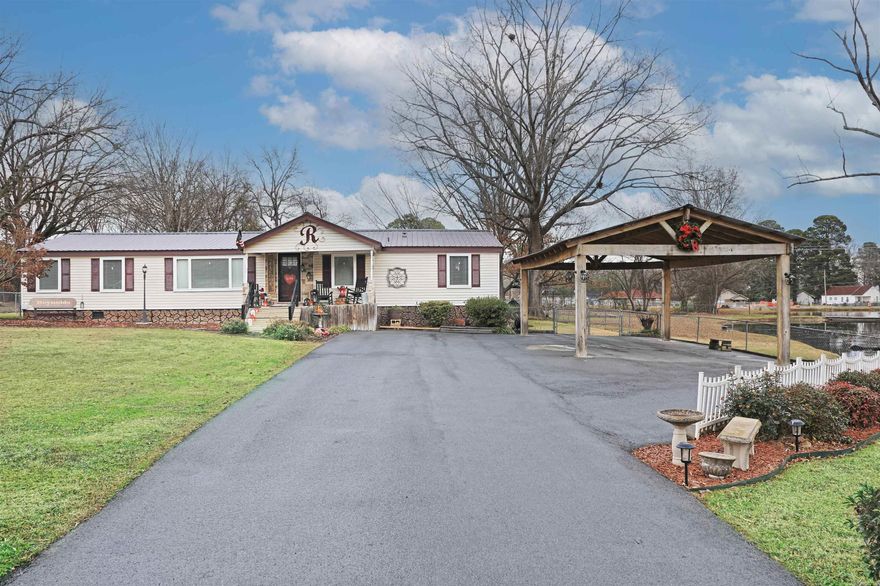 You must see this one to appreciate!  Many updates throughout this property. The home is all electric but does have a woodburning fireplace in the den.  Open living/dining area with game room/den complete with a pool table that will convey with the property.  Bath in the main bedroom has been updated. There are two HVAC units which were replaced inside and out about 3.5 years ago.  The kitchen has new countertops, microwave, new element in the stove, refrigerator will also remain.  New stackable washer and dryer in the laundry area which also has additional storage.  A floored attic with foam insulation and electricity.   The backyard is completely fenced and has a 14x20 shop with electricity.  A nice asphalt drive, covered parking for three vehicles.  Call today to schedule a showing.