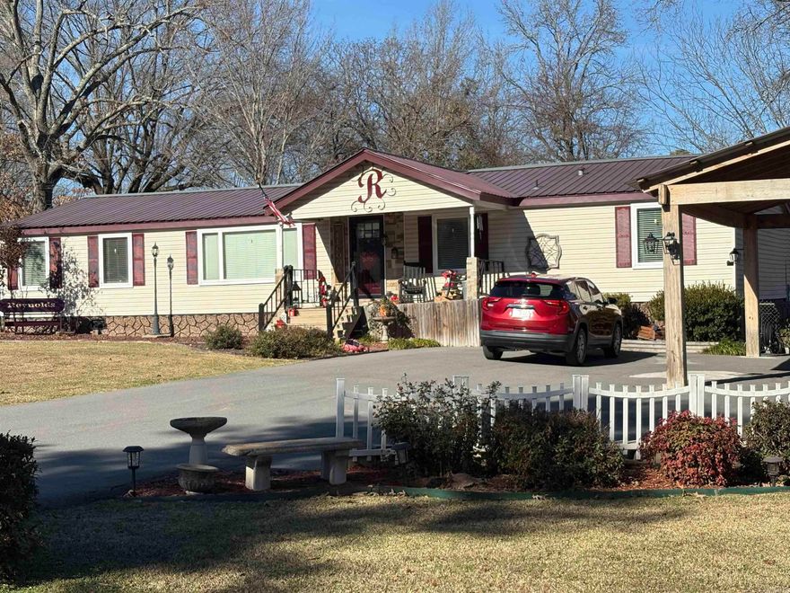 You must see this one to appreciate!  Many updates throughout this property. The home is all electric but does have a woodburning fireplace in the den.  Open living/dining area with game room/den complete with a pool table that will convey with the property.  Bath in the main bedroom has been updated. There are two HVAC units which were replaced inside and out about 3.5 years ago.  The kitchen has new countertops, microwave, new element in the stove, refrigerator will also remain.  New stackable washer and dryer in the laundry area which also has additional storage.  A floored attic with foam insulation and electricity.   The backyard is completely fenced and has a 14x20 shop with electricity.  A nice asphalt drive, covered parking for three vehicles.  Call today to schedule a showing.