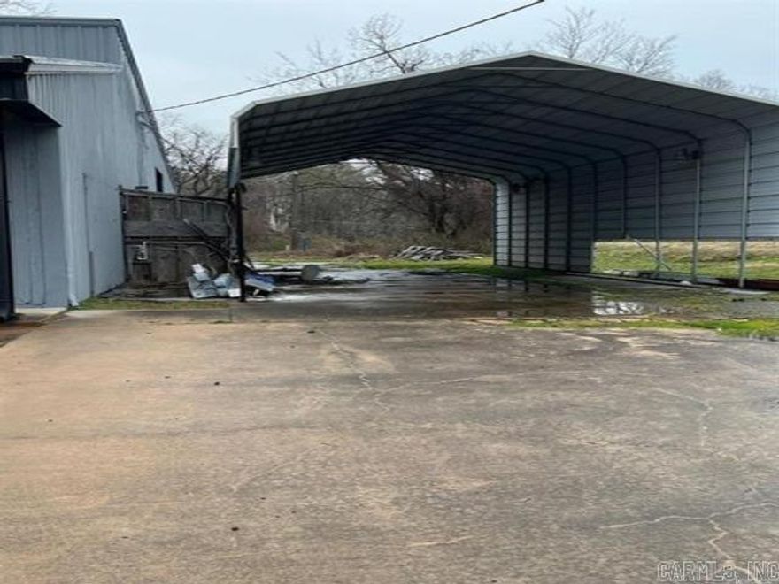 .14 acre commercial lot with large carport installed. This would be a good spot for a food truck or detail shop. Seller will owner Finance this property if someone is interested in buying it