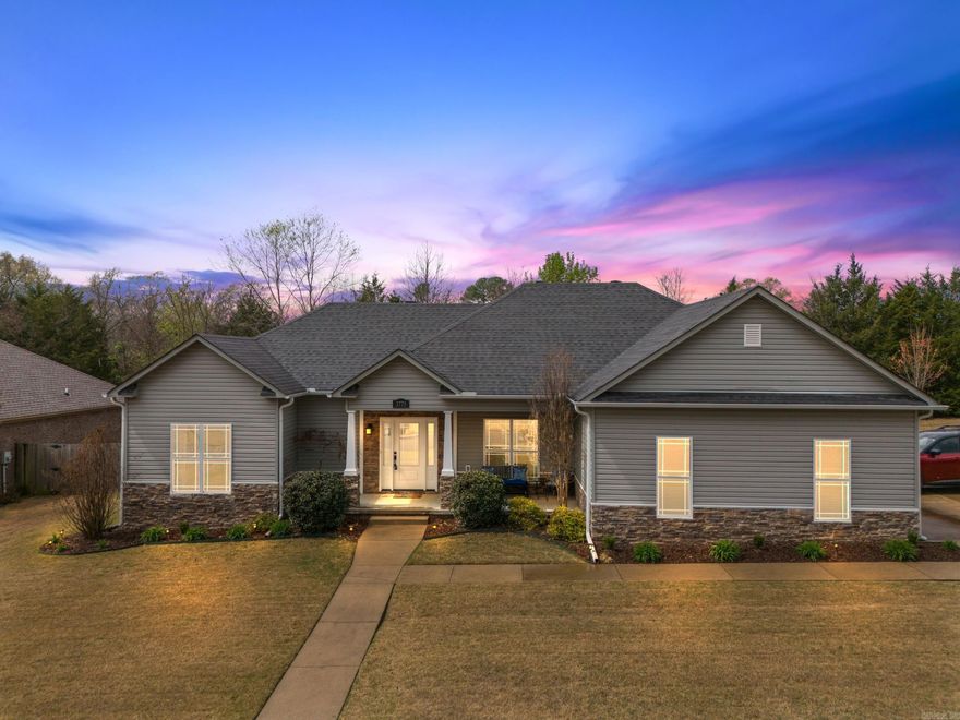 Stunning 3 bed/2 bath home in pristine condition that sits on an oversized lot just north of Conway. The front porch gives the home great curb appeal. Inside, you'll find an open concept living/dining/kitchen with beautiful engineered hardwood floors. The kitchen features dark cabinets and a gorgeous backsplash. The living room has a tray ceiling and corner propane fireplace that just needs an insert added. Split floor plan. The primary suite features a shower, separate jetted tub, and large closet. The home has a great floor plan with minimum wasted space. Inside the side-entry two car garage, you'll find an in-ground storm shelter.  This is great for peace of mind during Arkansas' spring storm season. As great as the inside of the home is, the outside is just as appealing. The backyard feels like an oasis. The large patio features a stunning wood pergola that is perfect for enjoying our beautiful spring evenings. No neighboring houses currently behind the property, which creates a private feel. Great location, out of town, but just 5 minutes to Conway. HVAC-2022; tankless water heater-2023; programmable thermostat; floored attic; fiber internet; security system.