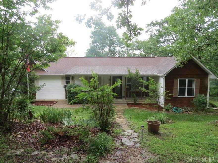 NICELY UPDATED 3 BR, 2 BA with granite counter tops, new flooring, custom built in bookshelf/entertainment center.  Lovely landscaping, two 12'x12' storage sheds/workshop with electric vented crawl storage. Sits on 13.28 AC M/L Close access to Lake Norfork.