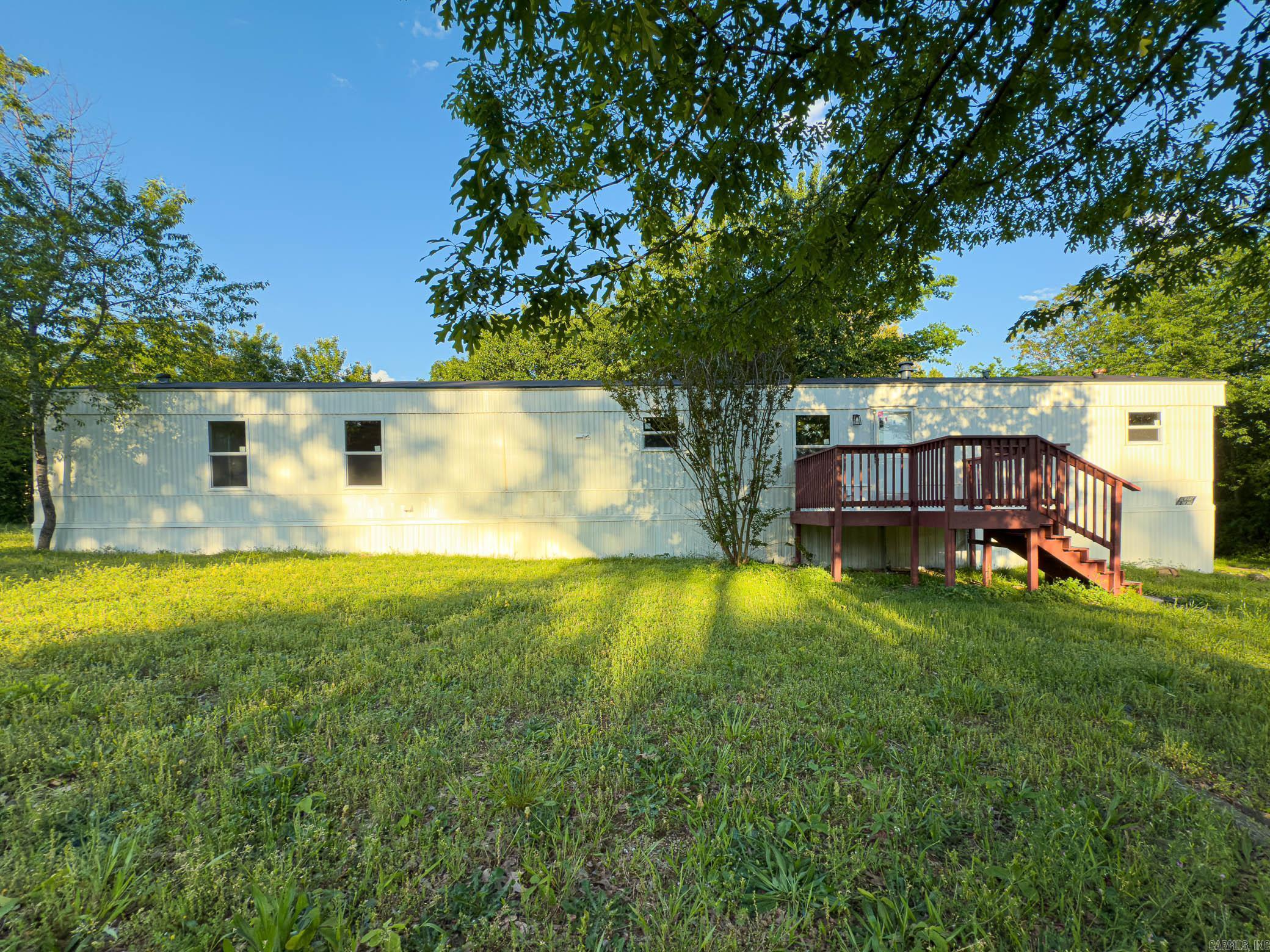 This charming 3-bedroom, 2-bath single wide home is situated on a permanent foundation in the picturesque Lake Hamilton School District. Recently remodeled, this delightful residence features fresh paint both inside and out, along with brand-new decks that invite you to enjoy the outdoor space. Step inside to find modern touches throughout, including new flooring, appliances, heating and air systems, stylish kitchen countertops, and updated bathrooms that enhance the home's appeal.