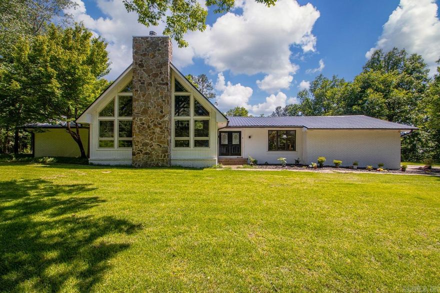 Tucked away on over 3 serene acres in the heart of W Little Rock, this one-of-a-kind property blends contemporary style w/exceptional amenities. Primarily one-level floor plan has a stunning 2-story vaulted great room filled w/natural light & is showcased by expansive walls of glass flanking the rock fireplace. Game room/office overlooks salt-water pool through glassy vaulted views as well. Lg primary bedroom offers living space w/automated wall curtain providing a private retreat. Remodeled primary bath (2020) offers a fresh, updated place to relax! Outdoor living space shines w/saltwater pool, cabana w/gas line for on-demand fire pit ambiance! Pool house w/tile shower, lg storage room & covered area for hot tub. Major updates: metal roof (2021), solar panels (2021), main HVAC (2026), secondary HVAC (2018), pool pump (2021), pool sand filter (2022), pool motherboard (2026), tankless recirculating hot water tank (2022). 16x20 workshop w/power. Minutes from Chenal Parkway, Kroger & Promenade, a once in a lifetime opportunity to own land plus enjoy convenience, privacy, thoughtful landscaping & abundant wildlife in a location that simply doesn't exit much any more! Your oasis awaits!