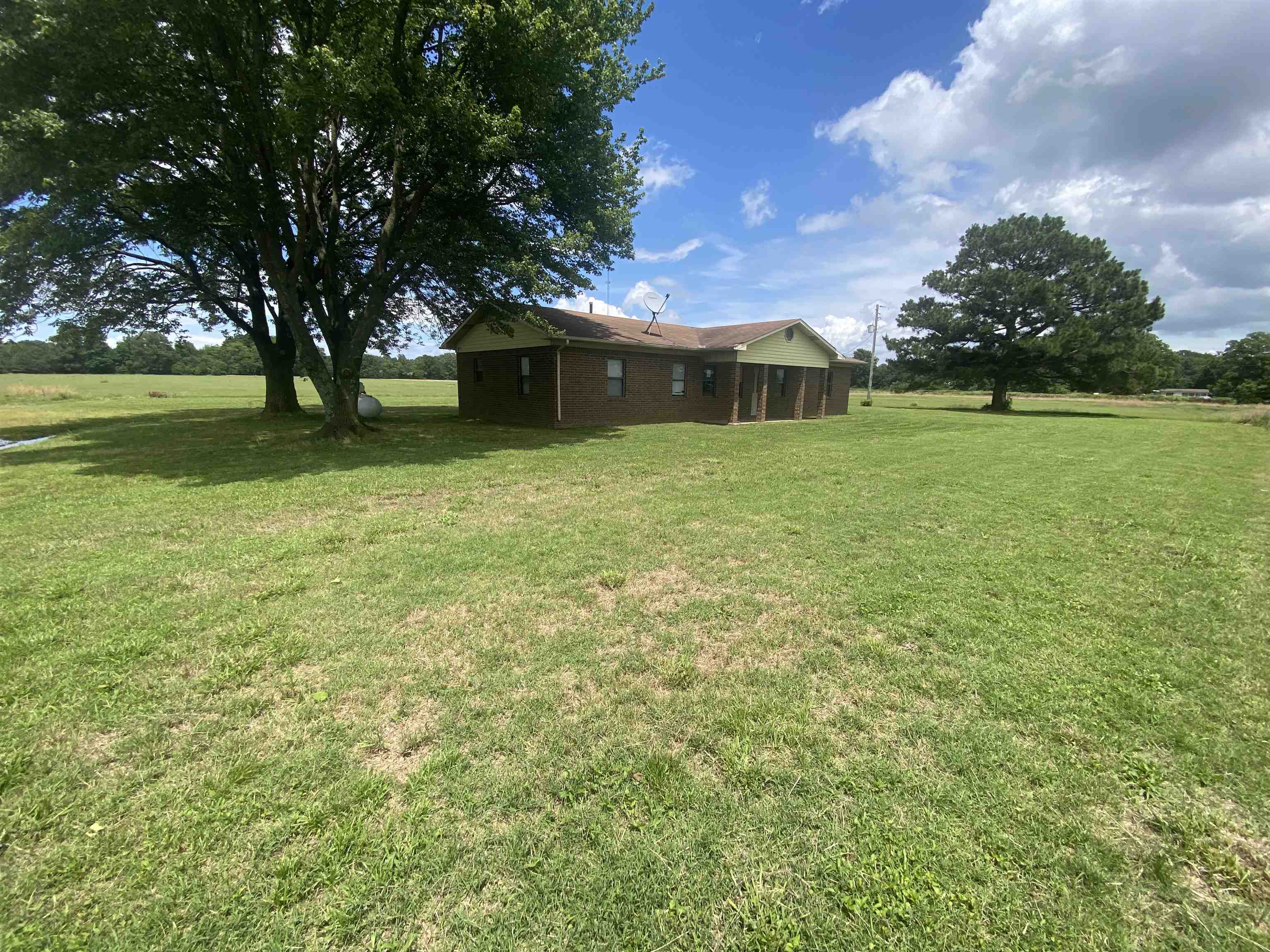 We are currently in the Highest/Best offer period. Country home on slab foundation with workshop with electric and full bathroom. The home has 4 bedrooms, 2 living areas (one with fireplace) 2 bathrooms, plus a 1/2 bath consisting of a 3rd shower and toilet. Large laundry room, and large pantry. Located in Valley View School district. Home needs your TLC and will not qualify for all loan types, but may qualify for Rehab loans. This is not in a subdivision and therefore not subject to a bill of assurance. You may park big trucks, campers etc.