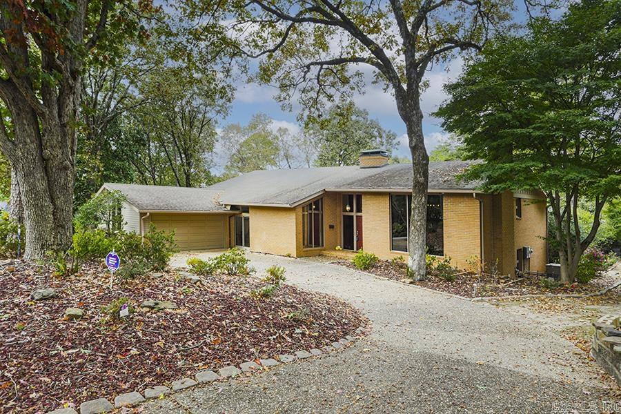 Welcome to this stunning one-owner home nestled in the trees of the highly sought-after Robinwood neighborhood. This spacious and meticulously maintained residence offers a wealth of luxurious features that are sure to impress such as premium cabinetry and whole house generator. With a prime location on a tranquil cul-de-sac and an expansive half-acre lot, this property provides the perfect blend of privacy and convenience. The main level offers a true showpiece of a living room, featuring beautiful wood beams and a cozy fireplace, making it an ideal space to relax. The separate DR is adjacent to the bright kitchen with large island, refrigerator and enclosed sunroom. On the lower level you'll find the large great room w/FP, wet bar, tv den, billiard room (complete with a pool table), impressive home office with extensive built-in shelving and sitting area that could also be repurposed for a 5th bedroom, if needed. There is also a huge laundry room complete w/washer/dryer & ironing board. The upper level boasts 4 bedrooms and 2.5 baths rounding out the private spaces for the family. Homes like this one don't come up very often, if you've been waiting, this is it! Welcome home!