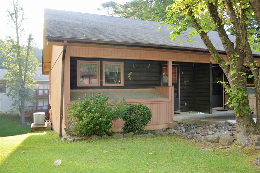 MOVE IN READY. 12 X 20 DECKS HAVE BEEN ADDED TO THIS UNIT. MAIN LEVEL DECK IS SCREENED (COULD ADD GLASS FOR YEAR ROUND ROOM)...LOWER DECK IS COVERED. Main level has a spacious Living-Dining, a nice kitchen with newer refrigerator, & half bath. Lower level has two BRS (both with HUGE CLOSETS) a full bath, & separate laundry room. Heat Pump has been replaced...New water heater 2012, New roof 2006, & newer berber carpet on lower level. GREAT LOCATION. MUST SEE!!!