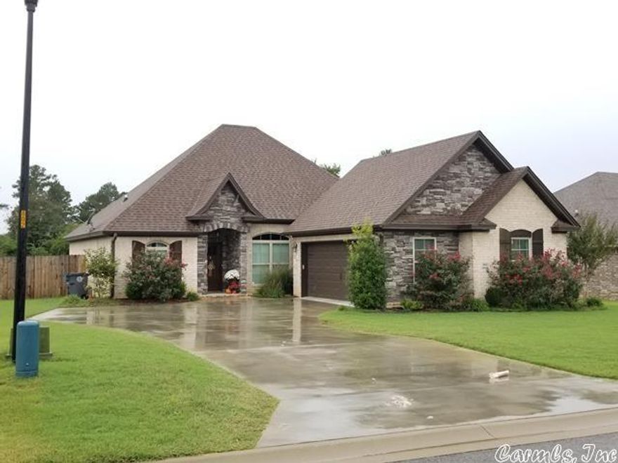 Great house for entertaining. Rock fireplace. Split bedroom plan.