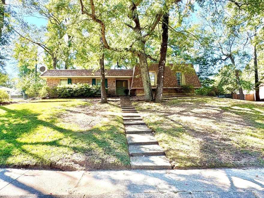 Located in Vivian Manor —a cozy, quiet neighborhood, this home is conveniently situated very close by both local schools, UAM, the square, & all other amenities in Monticello. The property is being sold “as-is, where-is”, & is ready to be customized by a new family to make it their own. The home offers possible flex spaces w/ both a den & formal living area, (used as an office), w/ newer flooring, a kitchen w/ breakfast nook, as well as a formal dining room. 2 bedrooms w/ newer flooring share a hall bath & the primary has an en-suite. The 2 separate backyard areas have potential for many uses like hosting family gatherings, gardening, outdoor storage, & more. The patio is perfect for dining outside or watching the kids & pets play! The concrete area w/ steps leading up was once a pool & is now filled in, but would make a great spot for a fire pit or a reimagined pool/lounge area. The HVAC is 6 yrs old & the fireplace is 3 years old. This home is full of character w/ the unique mansard roof (replaced in ‘23) which frames tall windows, concrete steps lead up to double front doors. The foyer has parquet floors & high ceilings like the formal rooms. Call now to schedule your tour!!!