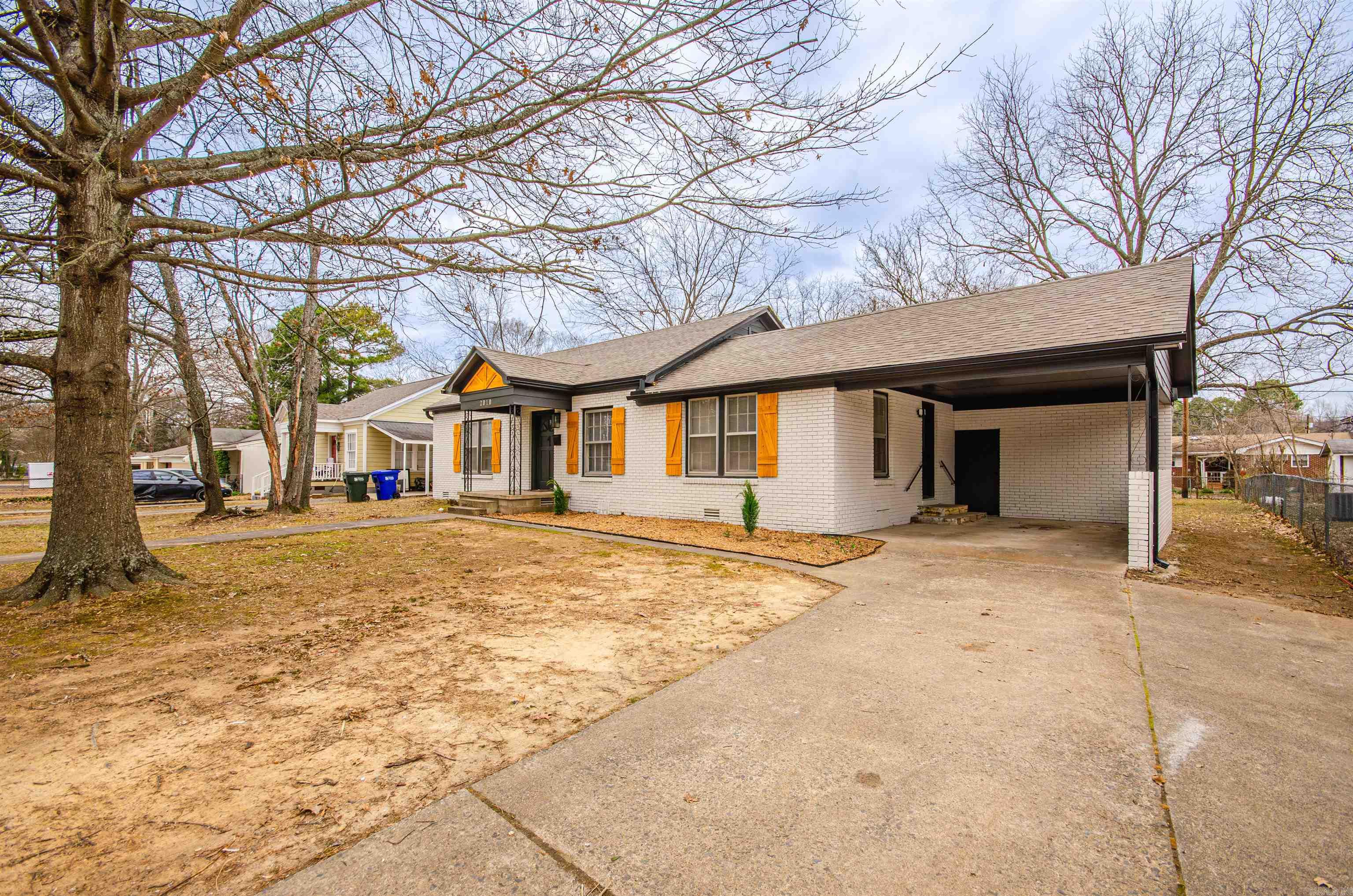 Welcome to 2010 Hairston, Conway, AR 72034—a beautifully updated 2-bedroom, 1-bathroom home that perfectly blends modern upgrades with timeless character! This 1,380 sq. ft. home features refinished original hardwood floors and elegant white marble tile in the den, kitchen, and bathroom. The updated kitchen boasts granite countertops, a stylish backsplash, updated cabinets, a stove, and a dishwasher. The spacious living room features built-ins and two windows, filling the space with natural light, while the adjoining den offers extra versatility with an additional closet and could serve as a third bedroom, office, or cozy retreat. The home has been meticulously updated, including a new roof, updated electrical and plumbing, new gutters, and fresh paint throughout. Outside, the large backyard is mostly fenced and beautifully landscaped with mature trees and rows of bright yellow flowers, providing a serene outdoor escape. Conveniently located in an established neighborhood near Simon Park and Tucker Creek Bike Trail, and just minutes from UCA, Hendrix, CBC, shopping, and dining, this home offers both comfort and an unbeatable location. $2000 is offered with an acceptable offer.