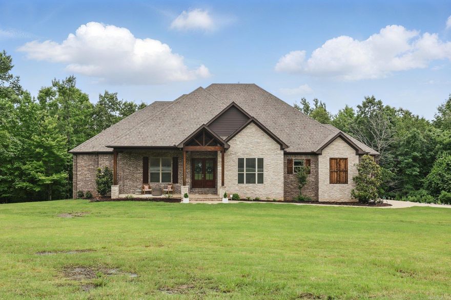 This stunning 4bed 2bath home sits on a beautifully wooded 3acre corner lot in the highly sought-after gated community of Westcliffe. This home offers a unique open floor plan that brings the outdoors in creating a serene, treehouse-like atmosphere. The spacious kitchen features a large island, walk-in pantry, and abundant cabinetry. Just off the garage, a functional mudroom with built-ins keeps daily life organized and tidy. The primary suite is a true retreat, complete with a tray ceiling and a must-see custom shower. The bedrooms include oversized closets, and the safe room adds an extra layer of comfort and security. You will find there is flexibility to create a home office, media room, or even a fifth bedroom to fit your lifestyle. Step outside and enjoy the expansive covered deck, perfect for morning coffee, outdoor dining, or cozy evenings by the fireplace while taking in the peaceful woodland views. Upgrades include a new roof (May 2025) and a new electric vehicle charger in the garage—offering modern convenience and peace of mind. Don’t miss your chance to own this immaculate home where privacy, nature, and thoughtful design come together in one exceptional property.