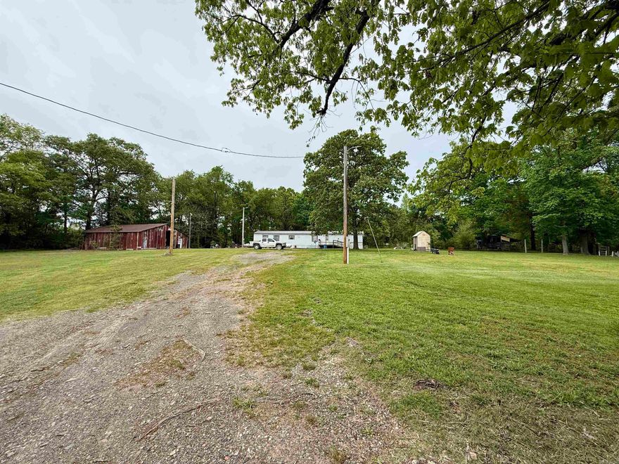 Country living at its finest, and priced to move. This 3 bedroom, 2 bath single wide sits on over 2 acres and is ready for your personal touch. The property offers a huge shop, livestock pens, fruit trees, extra power pole for RV, and a well-maintained yard with plenty of room for a garden, small homestead, animals, or simply enjoying the quiet country life.  If you have been looking for peace, space, and affordability, this one checks the boxes. Located at 618 Polk Road 24 in Cove, Arkansas, this property offers the kind of quiet setting most people only dream about, and it is priced low and firm for a quick sale.