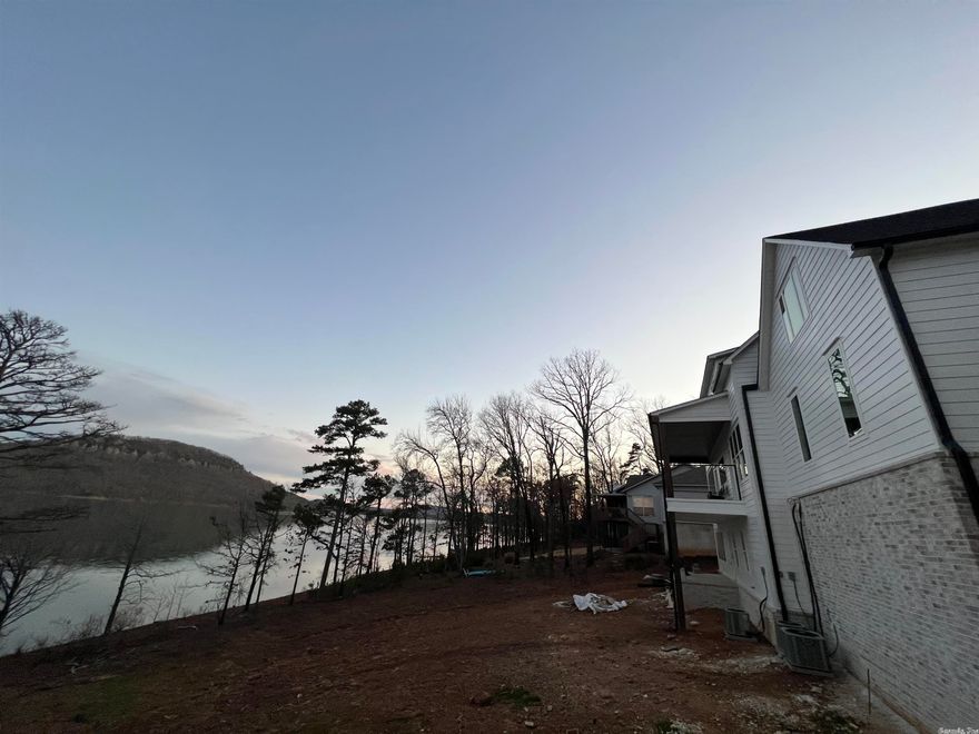 What a View Sugarloaf Island Anyone? New Construction that offers the  White Line Next to the Shore Line? 5 bed 3 bath 2 living spaces, master on main floor, 2 kitchens & more home sits on the shore line of Greers Ferry Lake, steering at Sugarloaf Mtn, Home is near completion. Exterior to be country white with white brick This Lake Home will have everything Your Family desires, being built On the Premier Lake Lot of the Year! 180 degree views of the lake! Boat slip optional add $30k near finished 30 days!