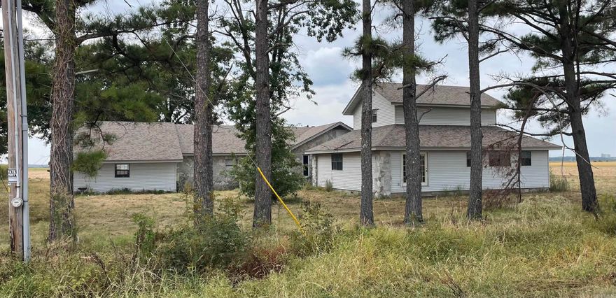 This home sits on 1.96 acres across from Fedex, East of city of Jonesboro. This home has a 3 car garage, 4067 square feet with two kitchen areas. Roof is newer and interior ceiling and walls appear to be in good shape. The floor joist along with subflooring and floor coverings need repaired or replaced.  THIS HOME NEEDS STRUCTURAL/ FLOOR JOIST REPAIR AND EXTERIOR UPDATING DEFINATELY A FIXER UPPER.