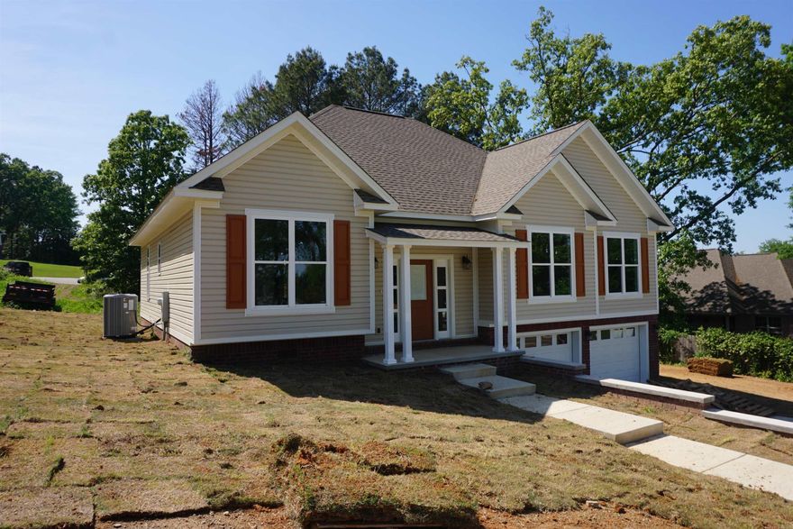 Beautiful new construction in West Searcy within walking distance to the Elementary school, Harps, and so much more. Nice entry into the house with multi level easy walking sidewalks, pretty front porch that opens into a nice foyer. The large living room is open to the kitchen/dining room, all with very pretty, neutral flooring. There are stainless steel appliances, and the custom built cabinets offer so much storage, and the granite countertops are beautiful. The house has a very open light and neutral vibe throughout. The laundry room also has custom built cabinets. The primary suite and 1 bedroom are on 1 side of the house with the en suite having a double vanity, soaking tub, walk in shower and large walk in closet with built in shelving and multi level hanging rods.  The other 2 bedrooms and a full bathroom each having their own private room with a vanity off the shared bathroom. There is a custom shoe closet at the front entry and a 1/2 bath conveniently located off of the living area. The double garage has room for a workbench or storage. The covered back porch is so nice and the yard has just been sodded. Taxes are land only from the courthouse records.