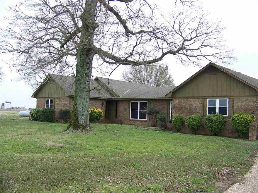 Great home in the country with3 large bedrooms 2 baths and lots of living area.  Large living room, den, dining room and a huge laundry room.  New flooring and windows throughout.  Sitting on 5+ acres.  Shop structure does not convey with this property ~ Exact acreage is pending a new survey