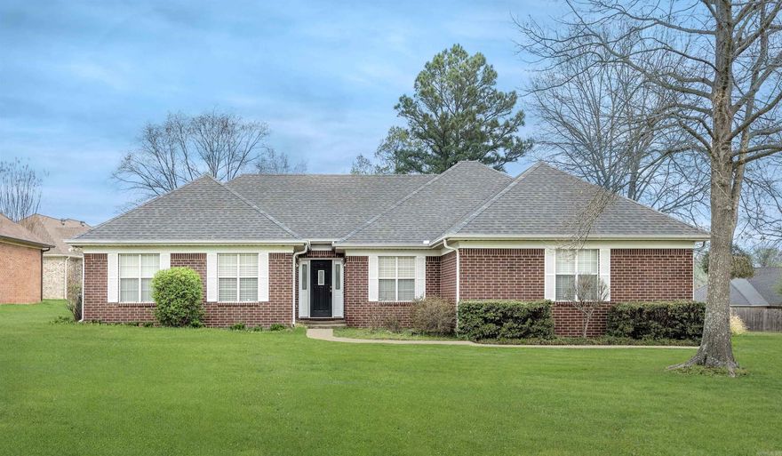 Charming all brick home featuring three bedrooms and two bathrooms a large lot with a side loading oversized two car garage.  Enjoy outdoor living on the screened porch and the convenience of the roof being replaced in 2022.  Freshly painted, this well maintained home offers both comfort and curb appeal.  Conveniently located within walking distance to Northside elementary!