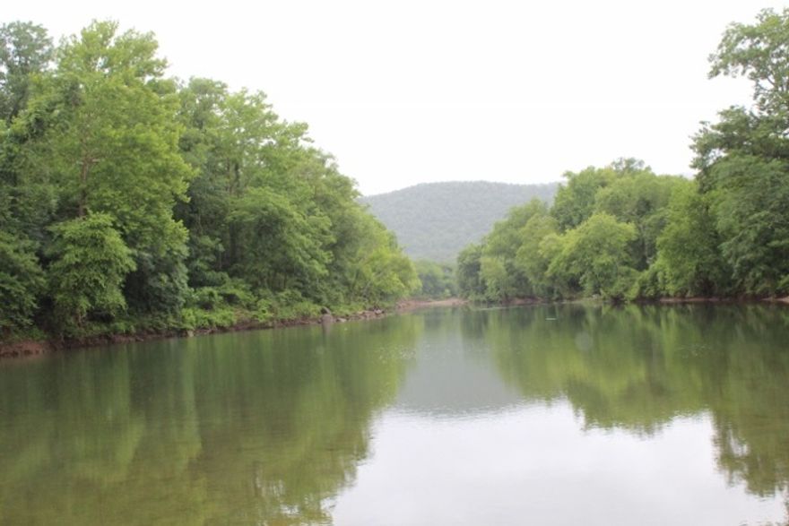 No. 01699 ACREAGE FOR SALE ON THE LITTLE RED RIVER.  This 1100 acre contiguous tract is a seldom seen opportunity. For the past several years it has been a protected Wildlife Refuge. You will find about every species of wildlife that lives in the Ozark foothills somewhere on this property.  With heavily wooded mountains and amazing rock formations to river bottom hay pastures that are fenced and cross fenced.  The Little Red River meanders through the property $2,035,000  Call 870-213-6209 for further info