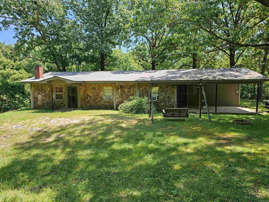 1 YEAR HOME WARRANTY AND OFFERING Discover the perfect blend of nature and comfort with this enchanting 4-bedroom, 2-bathroom home nestled near the Buffalo River, White River, and Greer Ferry Bay. Boasting an open concept design that seamlessly integrates the living, dining, and kitchen areas, this home has been a haven for a family of 6 and is now ready to create new memories with yours.  Situated on over 4 acres of picturesque land, this property offers an expansive playground for kids to explore the wonders of nature on the mountain. The captivating surroundings of the Ozark Mountains set the stage for endless adventures and outdoor activities.  Adding to the allure of this property is a spacious shop with concrete floors, providing ample space for various projects and featuring convenient shelves for organized storage. Whether you're a nature enthusiast, a growing family, or someone seeking a peaceful retreat, this home offers the perfect opportunity to embrace the beauty of the Ozarks.  Schedule a tour today and embark on a journey to make this charming residence your own, where the magic of the Ozark Mountains awaits.