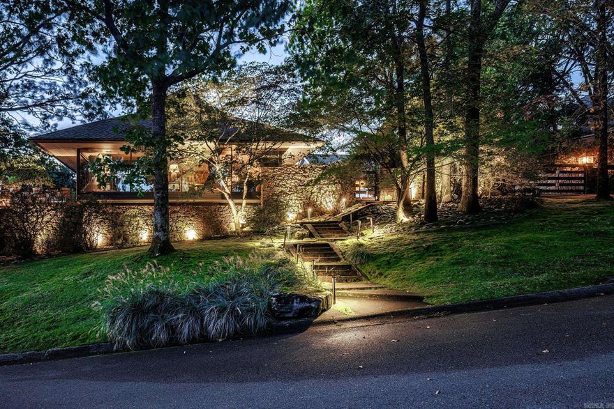 Modern Cromwell Masterpiece with Breathtaking Arkansas River Views. Perched on a coveted lot overlooking the Arkansas River, this modern Cromwell-designed estate is a true architectural masterpiece. Floor-to-ceiling windows frame panoramic views, including the iconic Big Dam Bridge, while flooding the interior with natural light. Designed for both luxury and functionality, this home boasts a chef’s kitchen with top-of-the-line appliances, sleek custom cabinetry, and premium finishes throughout. The seamless indoor-outdoor living experience is elevated by endless decks, a tranquil koi pond, a saltwater pool, and a cascading waterfall—perfect for relaxation or entertaining. A gated driveway ensures privacy, while a home generator provides peace of mind. Surrounded by extensive landscaping and lush outdoor spaces, this home offers a rare blend of sophistication and serenity in one of the most sought-after locations. Don’t miss this extraordinary opportunity to own a true riverside retreat. AGENTS SEE REMARKS