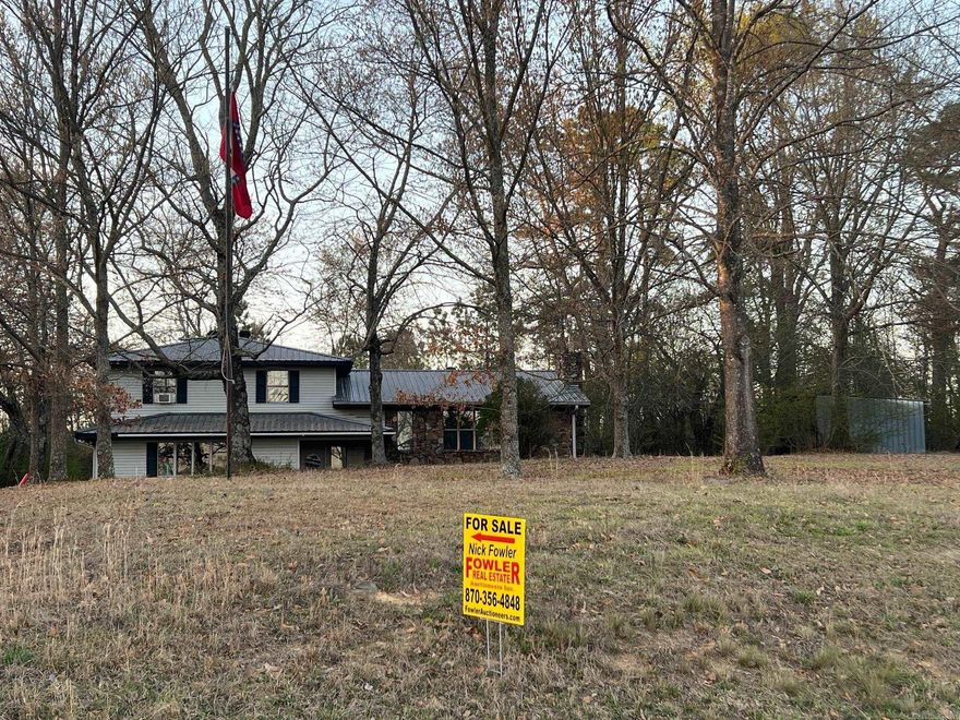 Beautiful Two Story Home on 6+/- Acres just outside Newhope, AR Home has Wall Heaters, Pellet Stove for heat and Window Unit Air. Chain Link Fenced Back Yard, Rock Patio and Small Creek.