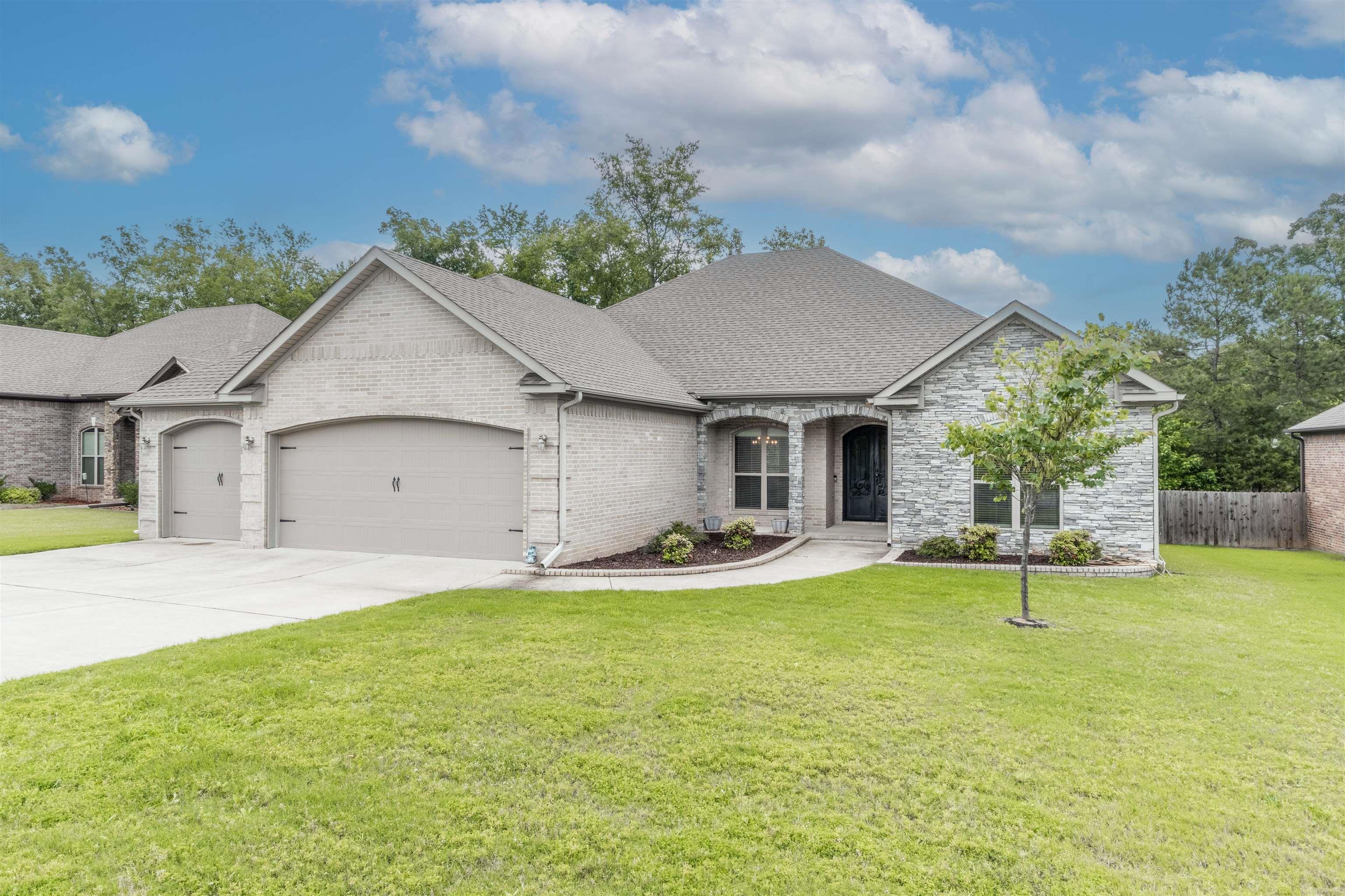 Amazing Home in Millers Cove. The home features a well designed open floor plan with 4 bedrooms and 2.5 Baths . High end finishes throughout the home, wide plank floors , tile in the Kitchen and baths....granite countertops in the Kitchen and Bathroom(s) and even the laundry room. The kitchen is equipped with stainless steel appliances, an abundance of cabinetry, a large pantry , making it ideal for cooking and entertaining. Additional highlights: Huge Master closet with walk-thru to laundry room, an amazing concreate covered deck and a 3 car garage with a stairway to to second story floored attic. Huge!! Don't miss this one!!
