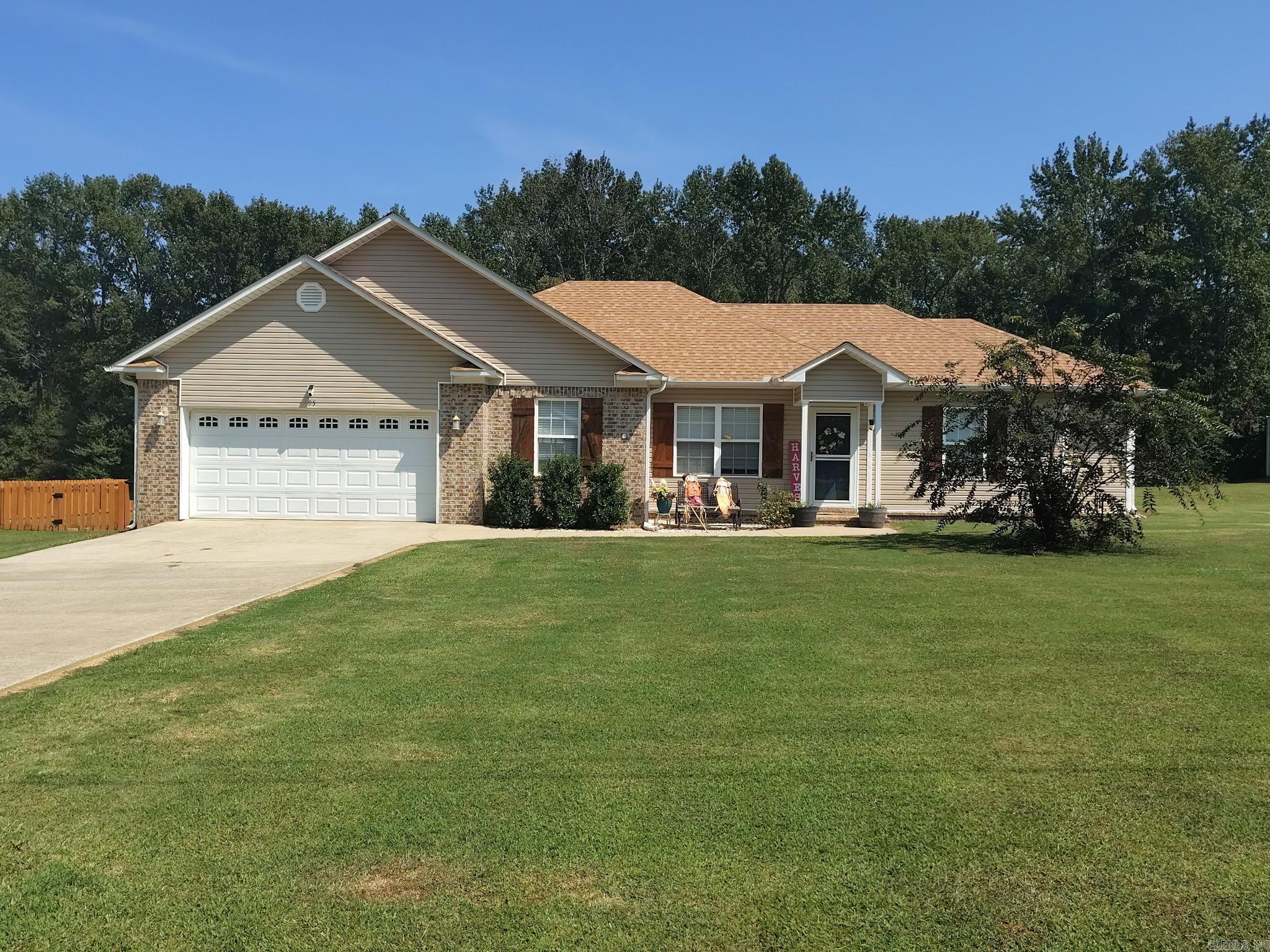 Nicely updated 3 bedroom, 2 bath home with 2 car garage with well over an acre yard. Spacious yard includes privacy fence, patio, chicken house, 18' above ground pool & a 20x20 shop with 2 rollup doors. The yard goes into the trees at the back for privacy. Kitchen remodel includes new granite countertops, new sink & faucet & new dishwasher. Several shiplap accent walls around the house, new laminate flooring in living room & halls. The garage has a recently installed Mini split to regulate temperature & the architectural roof was replaced in 2024 & the water heater was replaced in 2023. It also features gutters, a tray ceiling in living room & a separate laundry room. Appointment only.