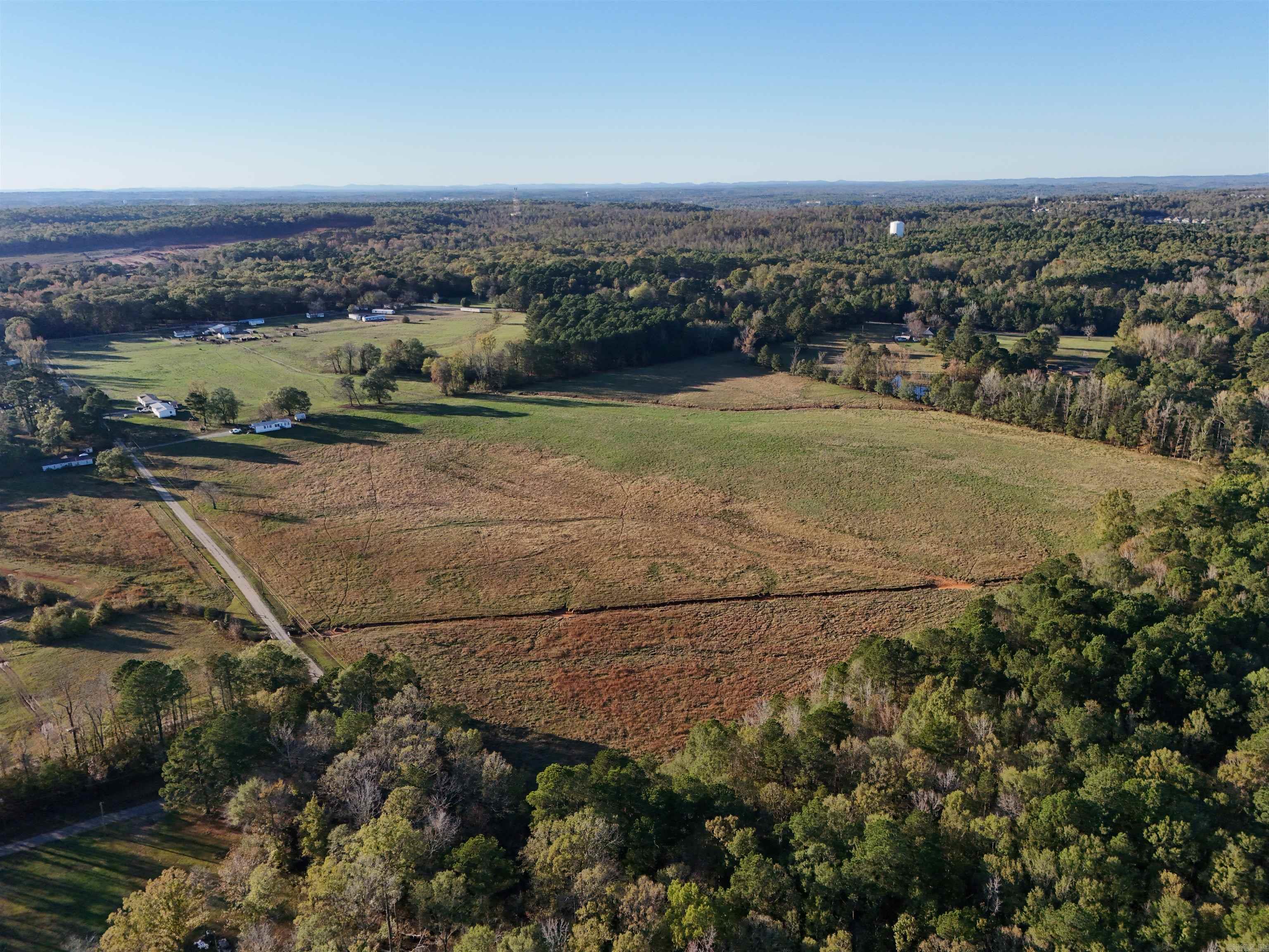 Great Development Opportunity!! This 77.71 Acres is a rare find. Located only minutes from Little Rock & Bryant makes it the perfect spot for a development. It includes a Horse Barn and is completely fenced. There are currently 7 Doublewide Mobile homes on the property. They can be purchased with the land or the seller will have them removed.