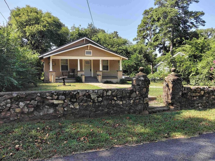 This delightful single-story home blends classic curb appeal with fresh interior upgrades. The welcoming front porch sets the tone, framed by a tidy lawn, stone pathway, and mature landscaping.  Inside, the kitchen shines with stainless steel appliances, granite-look counters, crisp white cabinetry, and a stylish backsplash. The spacious layout flows easily into the living areas, featuring abundant natural light.  The residence offers 2 bedrooms and 1 modern bathroom, which boasts a marble-look floor, a modern vanity, and ample storage. Additional living spaces include a bright laundry/mudroom.  Outside, the home offers a yard and a second entrance, perfect for added convenience. From its charming exterior to the modern interior finishes, this home is ready for you to unpack and enjoy.