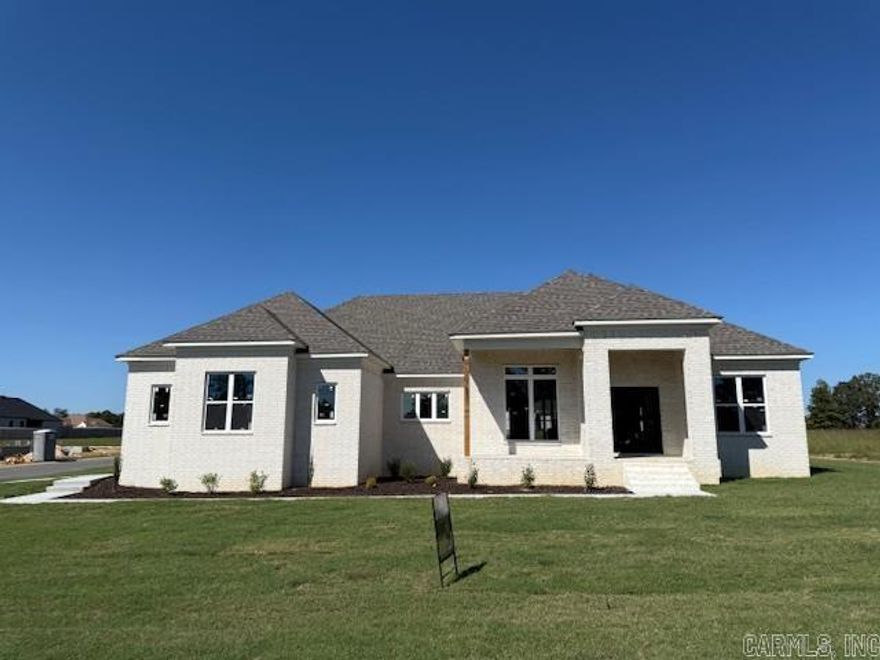 Builder offering $5,000 concession with an accepted offer. Concession can be used for interest rate buydown, closing cost or buyers' choice. Seller also offering 2-10 home warranty. Discover the perfect blend of elegance and comfort in the stunning all-brick, French country-style home. With 3 spacious bedrooms and 2 luxurious bathrooms, as well as 1 half bath this exquisite property offers an inviting retreat for both relaxation and entertainment. As you step through the front door, you'll be greeted by an expansive living area bathed in natural light, thanks to the large windows that highlight the beauty of your surroundings. The formal dining room awaits your cherished family gatherings. Culinary enthusiasts will adore the kitchen and large pantry for extra organization and storage. The custom tile shower in the primary bathroom adds a spa-like experience to your daily routine. Outdoor living is equally impressive with a large, covered patio providing the perfect backdrop for weekend entertainment. Additional features include a two-car garage offering ample parking space and storage. This home is a haven of sophistication and warmth, ready for a family to create lasting memories.