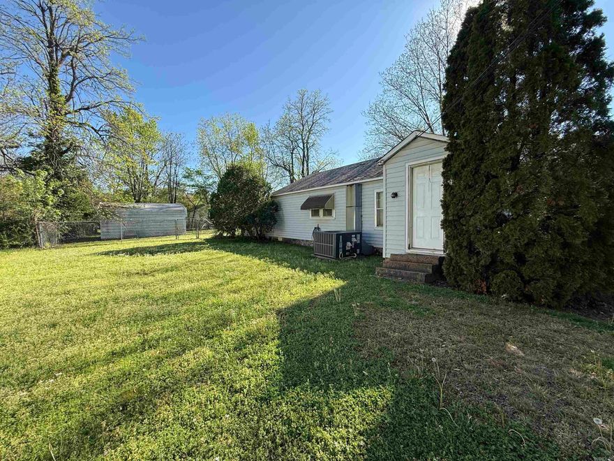 Check out this cozy 2 bedroom home located in Corning, AR! Situated on a huge corner lot, this home has everything that you need. The carport was closed in creating extra living space, drive way has a covered parking pad, and don't miss the 20 x 30 outbuilding out back with a fenced-in back yard too. HVAC is a 2023 and the refrigerator stays. Call for an appointment. Selling AS IS, WHERE IS.